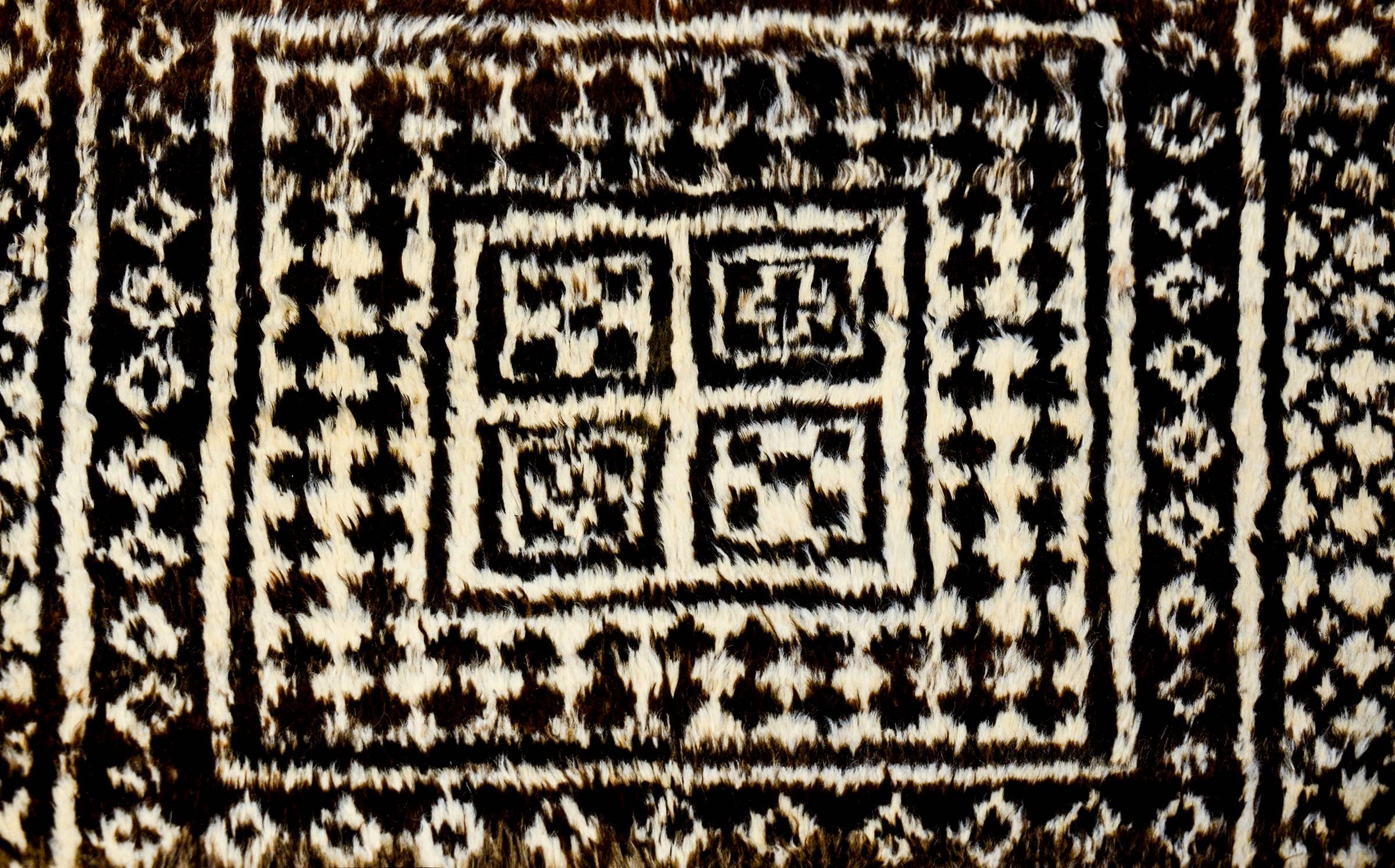 An incredible 19th century Persian Gabbeh rug with an amazing geometric pattern of diamonds, squares, zigzags, checkerboards, and chevron stripes, all woven in natural undyed wool.