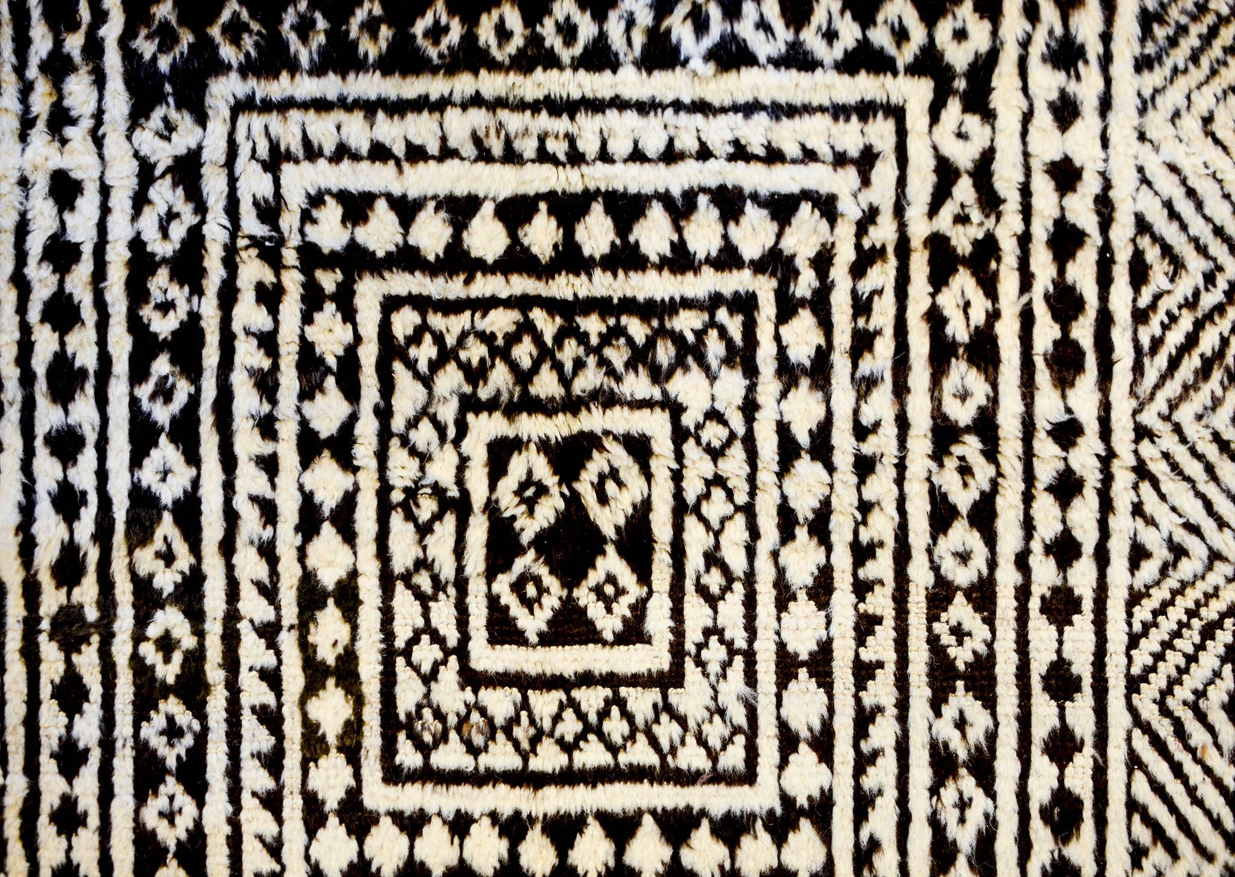 An incredible 19th century Persian Gabbeh rug with an amazing geometric pattern with diamonds, square, zigzags and chevron stripes, all woven in natural undyed wool.