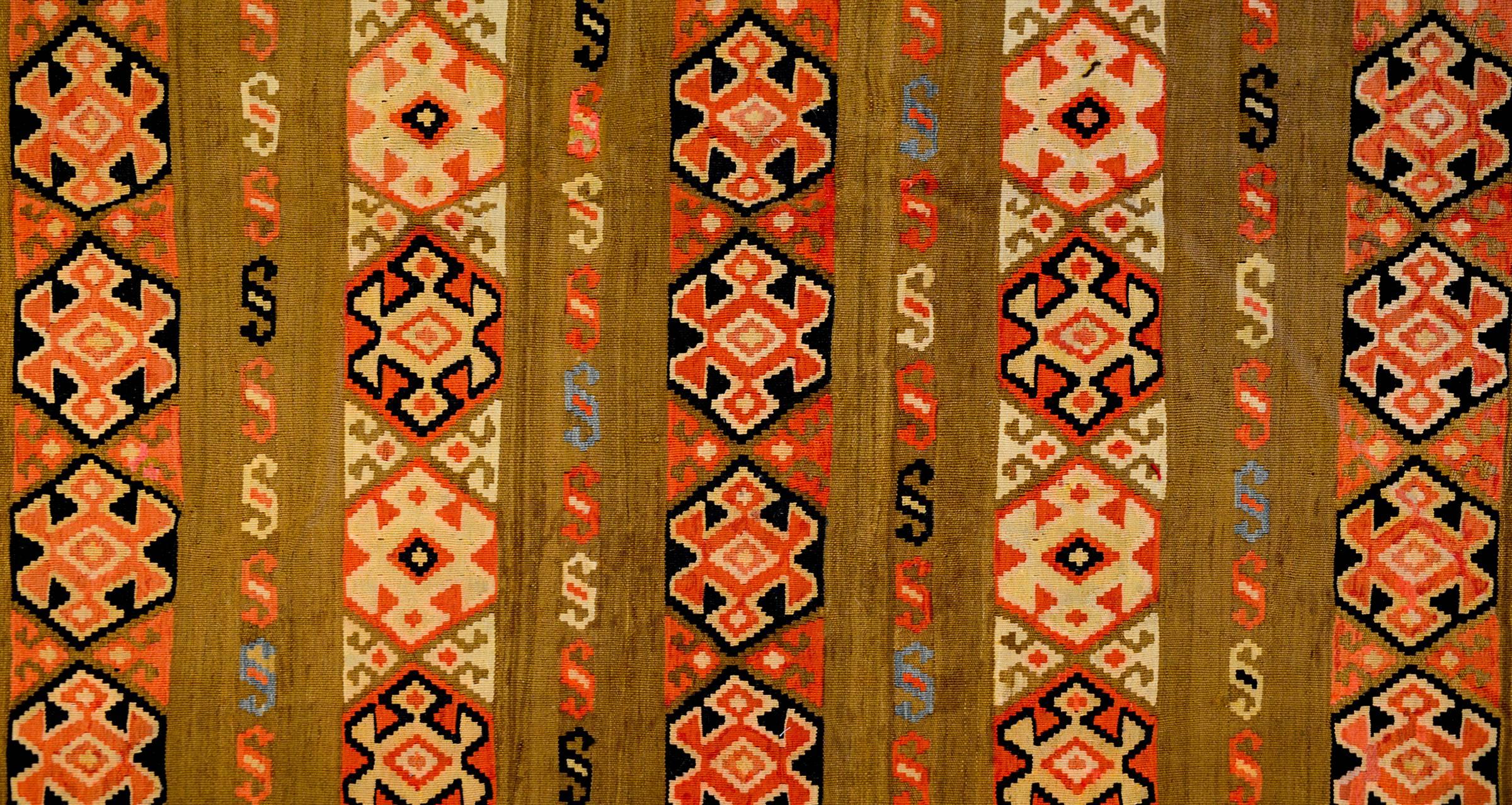 An incredible mid-20th century Persian Zarand Kilim runner with a beautiful pattern containing stripes of stylized geometric flowers alternating with 