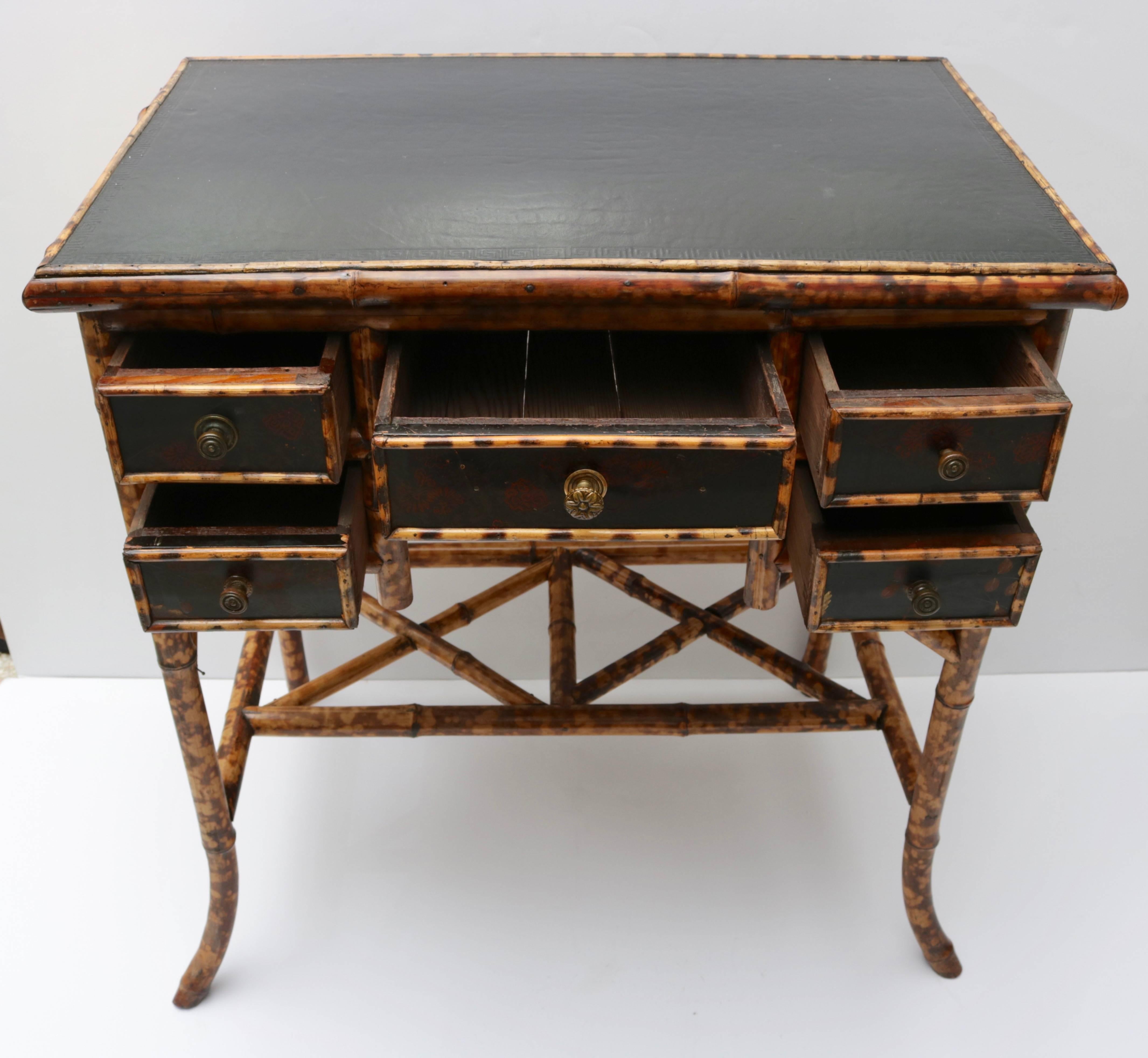 This stylish desk was recently purchased in London and has been restored to its full glory with its tortoise bamboo frame, black leather top and lacquered drawer fronts.
 
For best net trade price or additional questions regarding this item,
