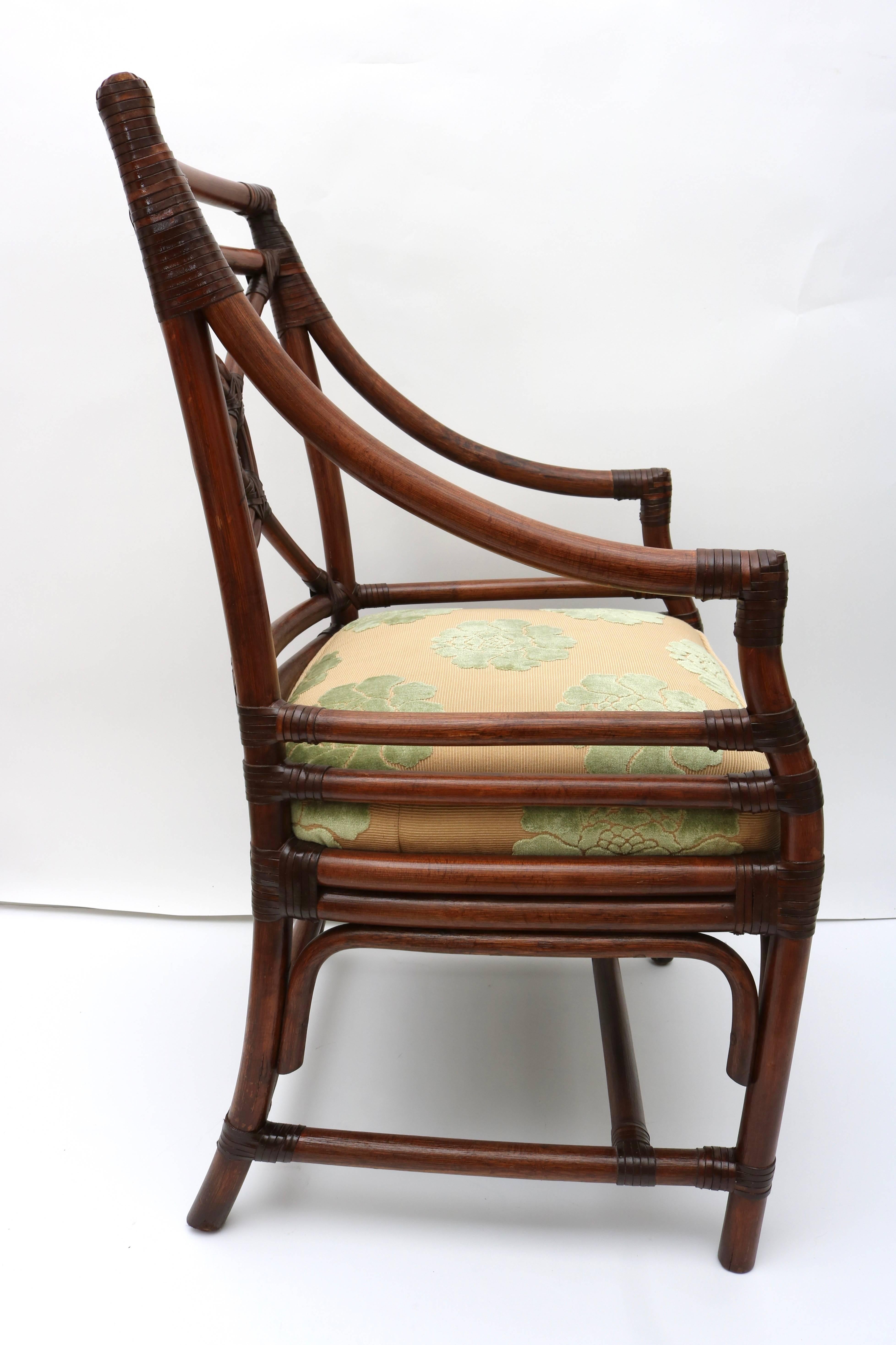 This pair of rattan chairs are by the iconic American firm of McGuire furniture and are in a tobacco colored finish with and upholstered seat fabric in butter-gold and celadon green.
 
For best net trade price or additional questions regarding