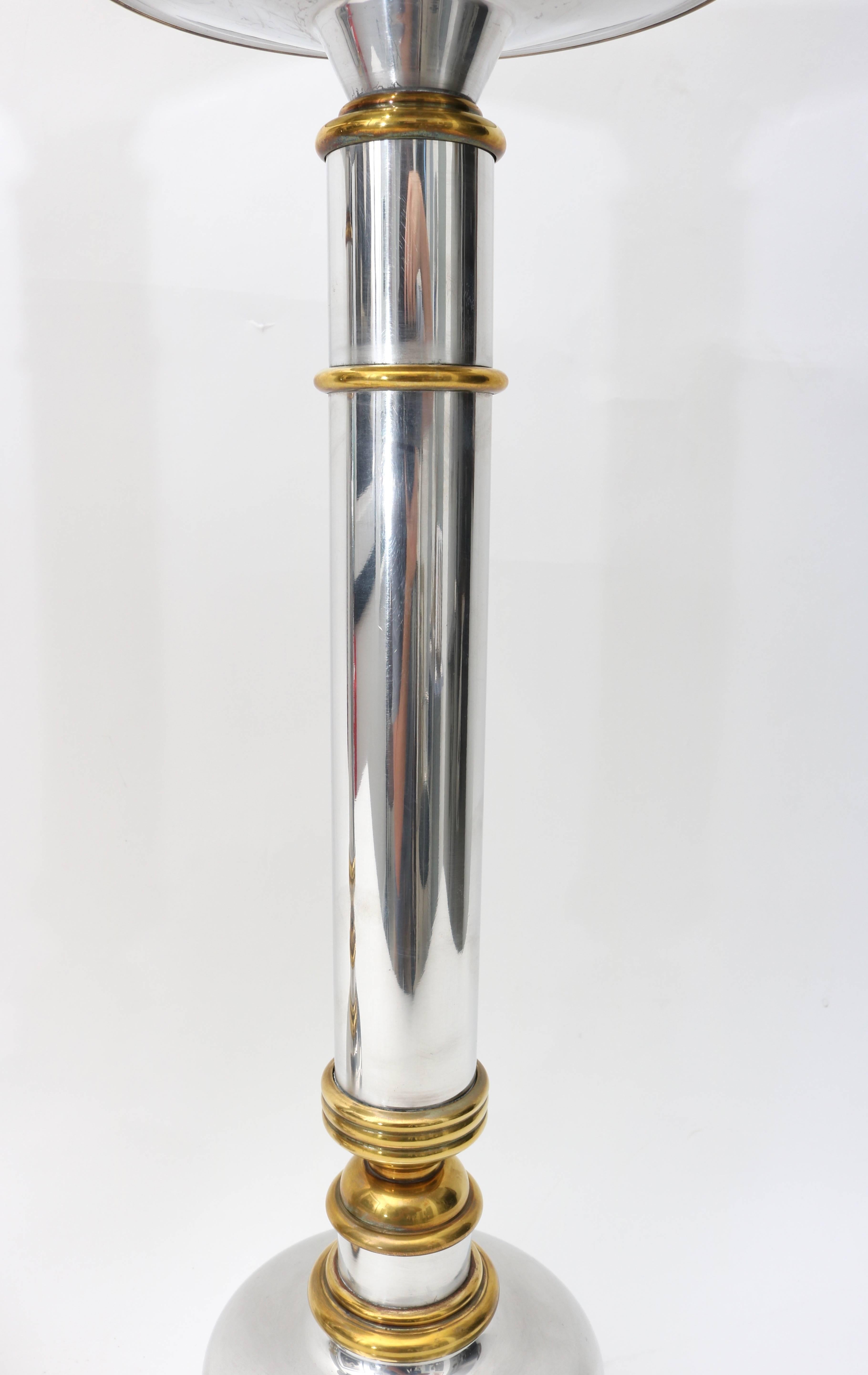 American Pair of Polished Aluminium and Brass Candlesticks