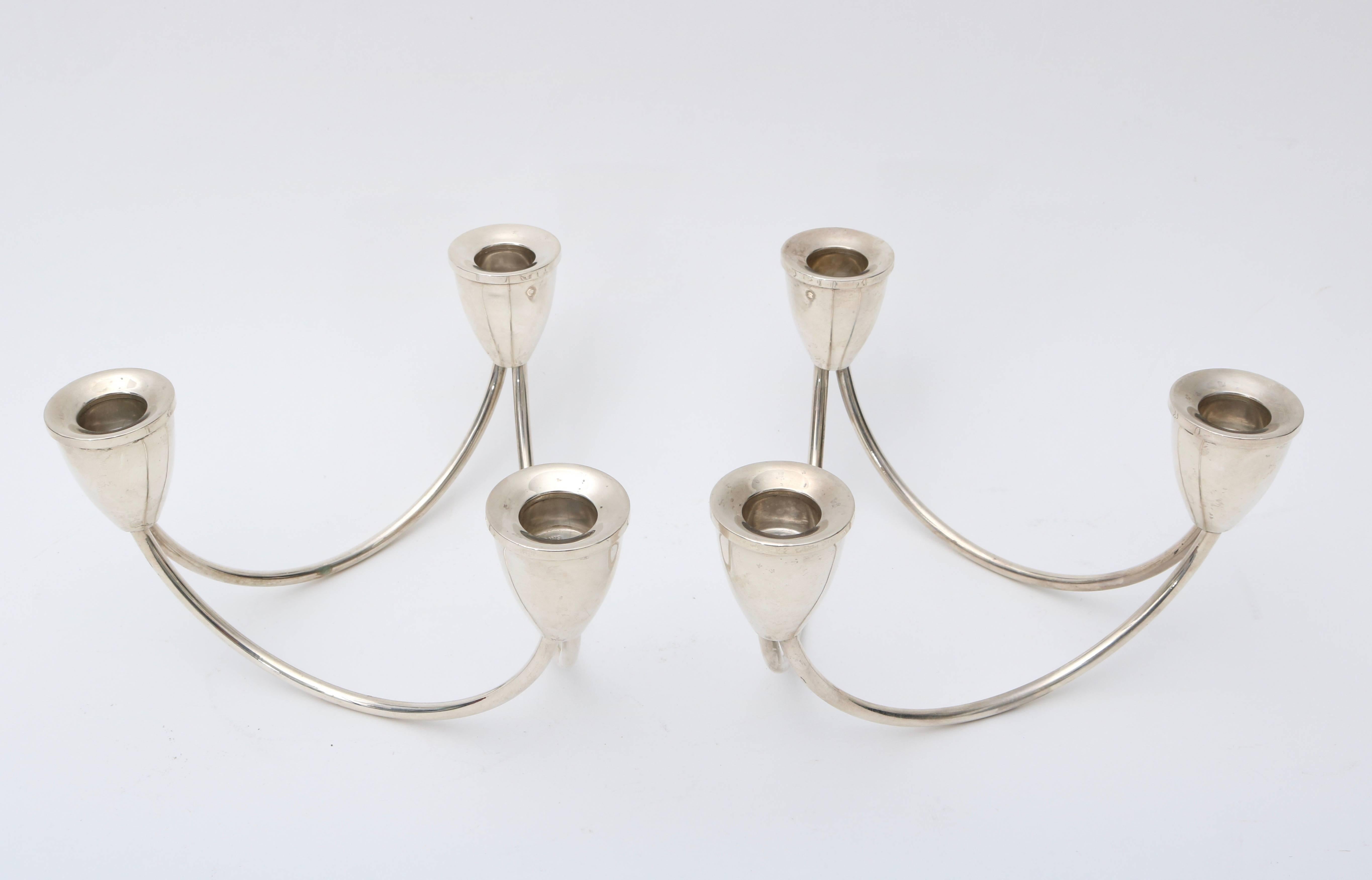 This stylish pair of sterling silver candleholders by Maurice Duchin date from the Mid-Century and can be used separately or combined.

For best net trade price or additional questions regarding this item, please click the 