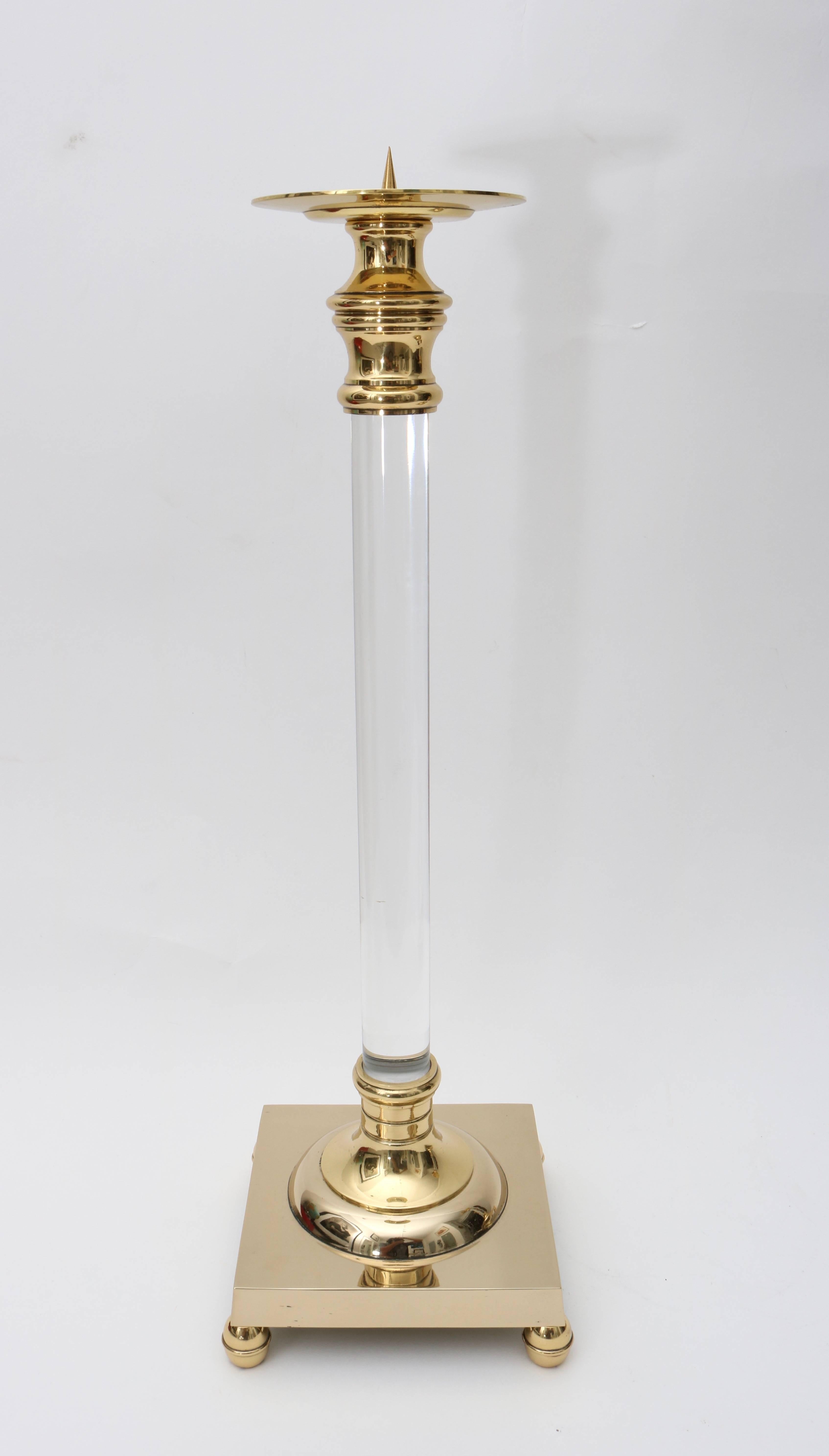 This stylish three-piece set of Lucite and brass candle sticks have recently been professionally polished and lacquered.

Note: Dimensions of tallest candlestick. 18.50
