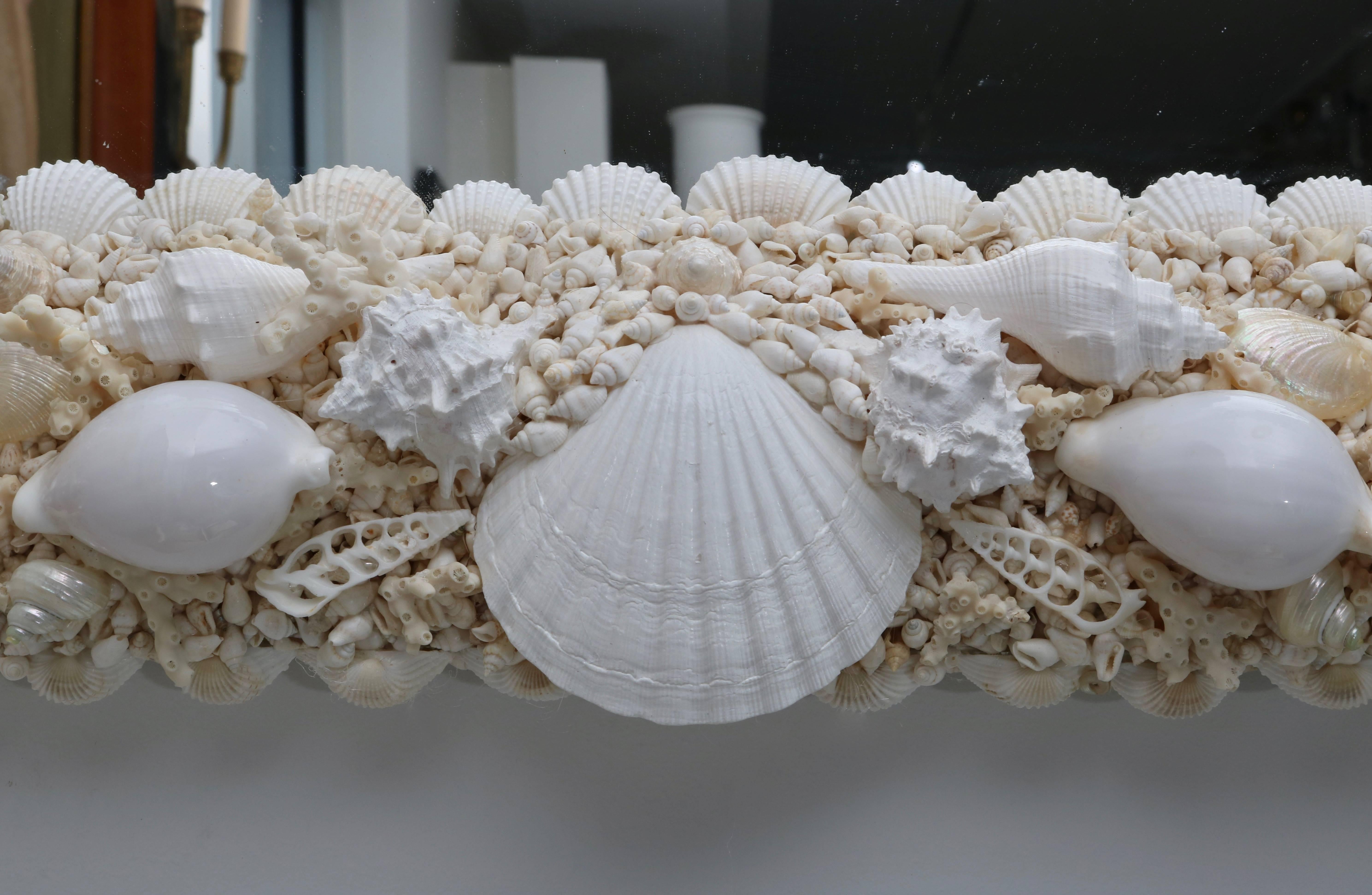 This stylish seashell encrusted mirror was made by a local Palm Beach artisan and definitely takes its inspiration from pieces used in the interiors of Tony Douquette.

For best net trade price or additional questions regarding this item, please