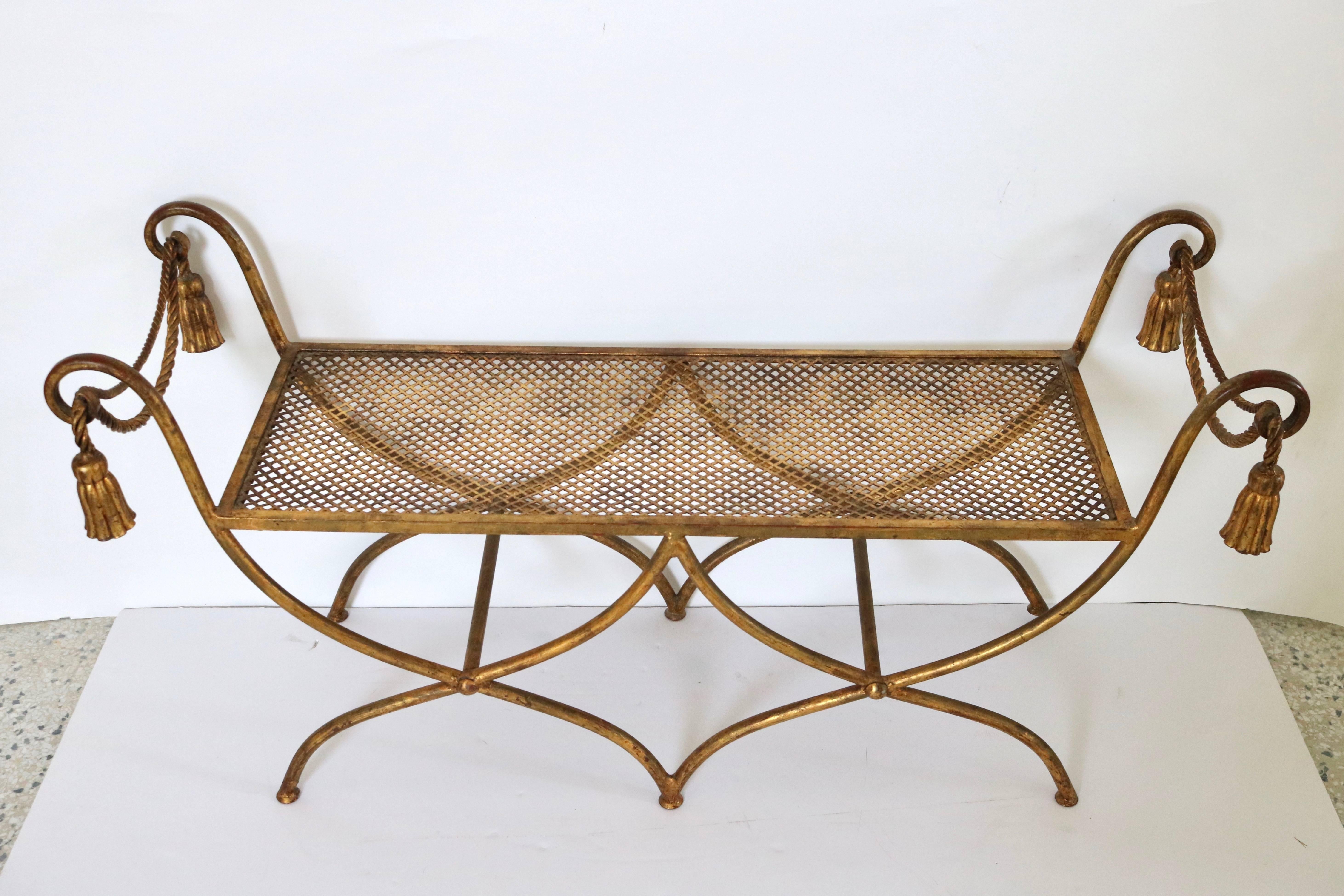 This stylish Hollywood Regency style bench dates from the 1960s and will make the perfect piece for the entry hall, vestibule or perhaps at the end of the bed.
The fabric is a woven texture in a soft apricot coloration which compliments the gold