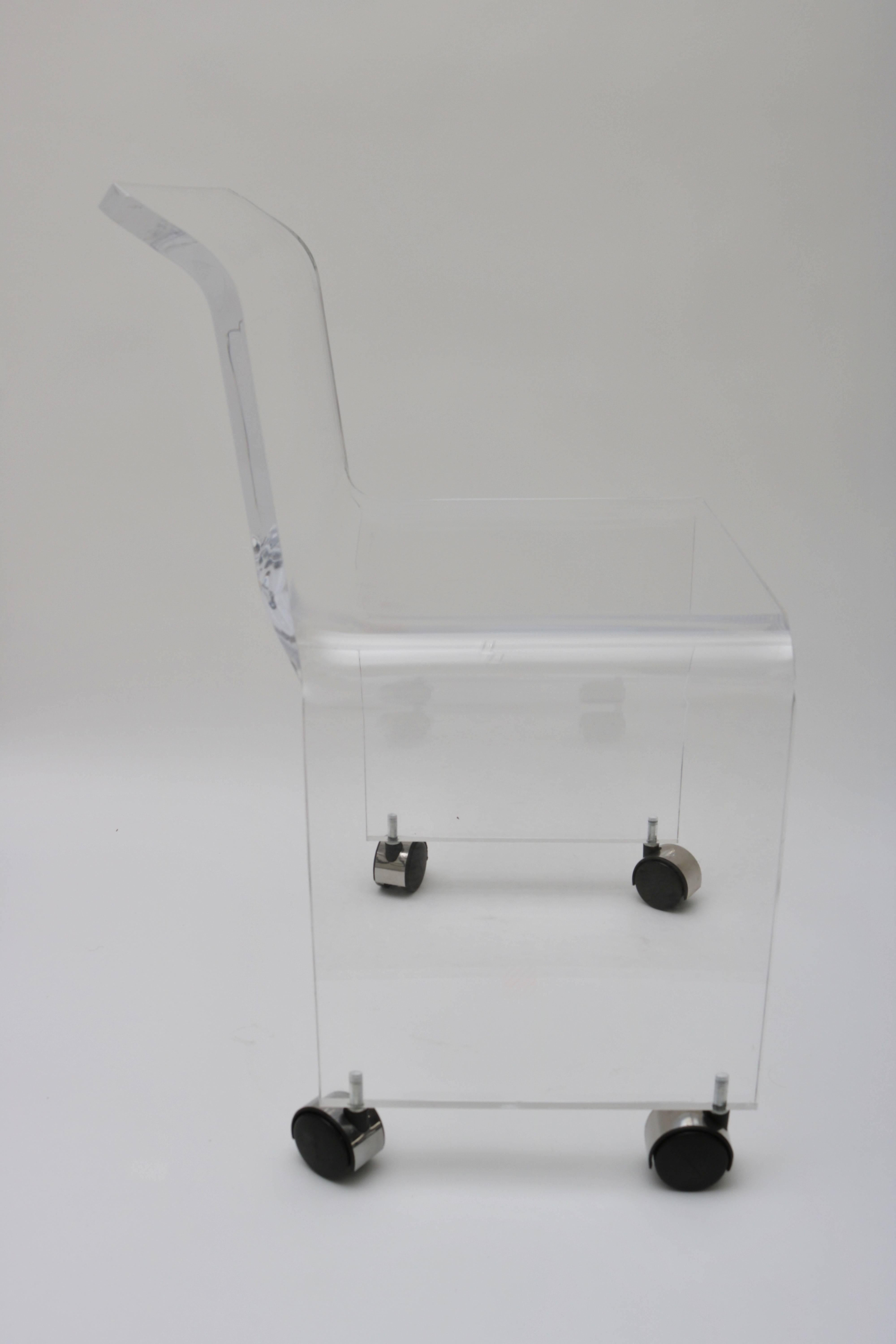 This stylish Lucite vanity stool has been professionally polished and is very much in the style of pieces created by Charles Hollis Jones in the 1970s.

Note: As its very difficult to photograph lucite we have done our best to show any hazing or