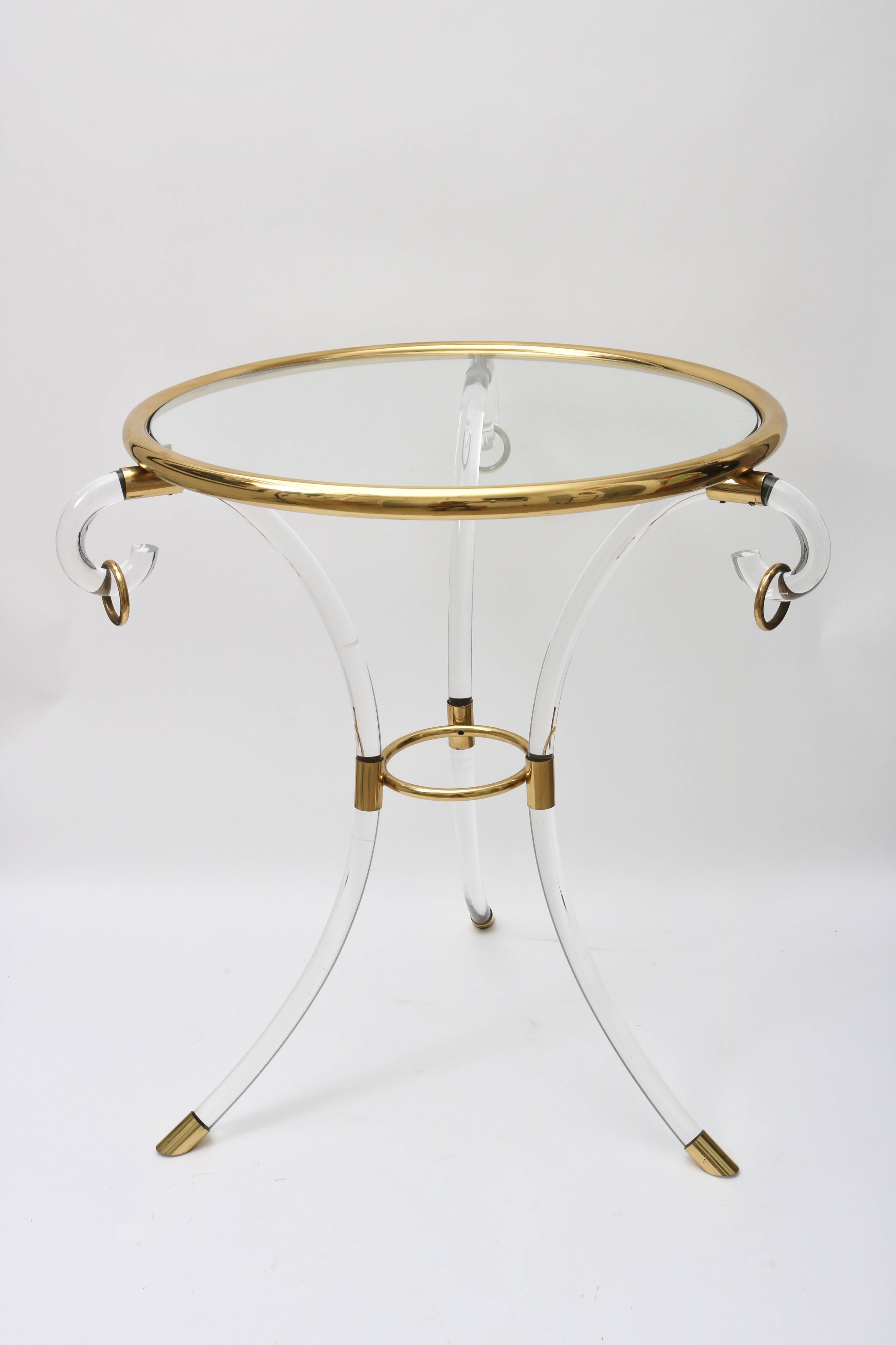This rare and amazing guerdon tables was recently purchased in Italy and was designed by the iconic American furniture designer Charles Hollis Jones. The Lucite, brass and glass are in excellent condition and most importantly retains its original