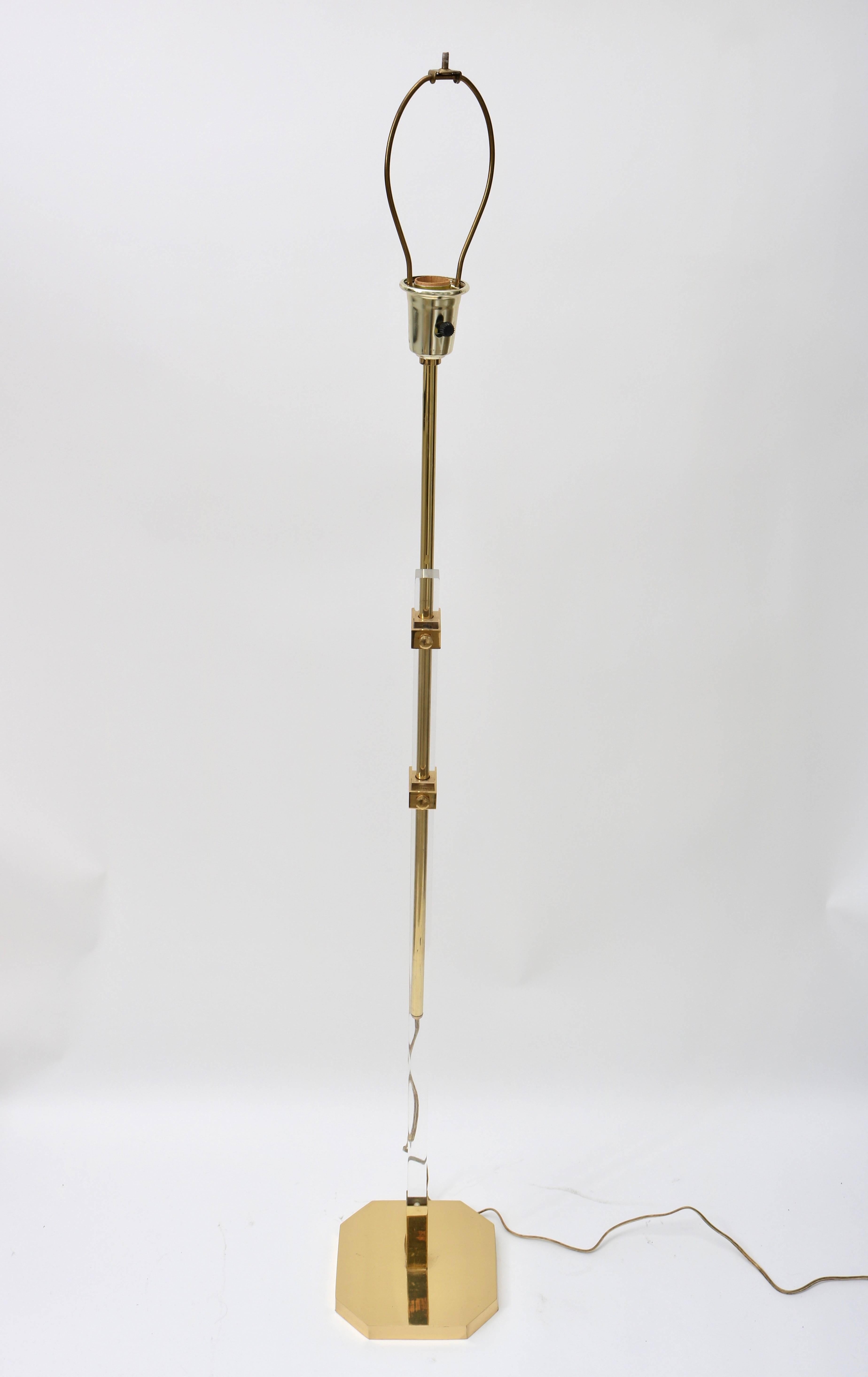 
This stylish adjustable floor lamp is very much in the style and quality of pieces designed and created by Charles Hollis Jones in the 1970s and 1980s. We have listed the metal as polished brass but it has a polished gold-plate look and quality to