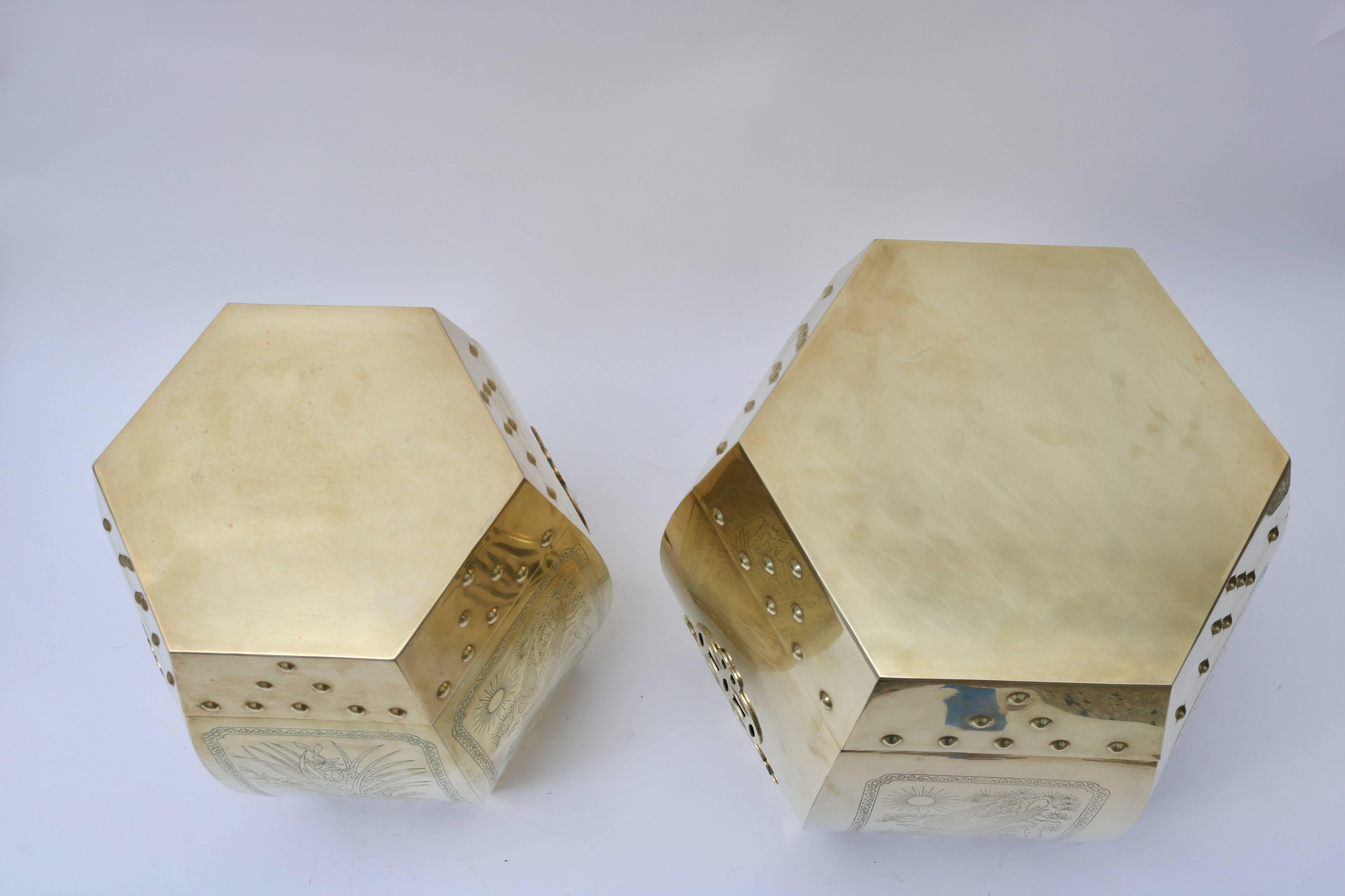 This stylish set of two brass garden stools were fabricated in Hong Kong and date from the 1960s-1970s. 

Note:   Dimensions of smaller stool 16.50