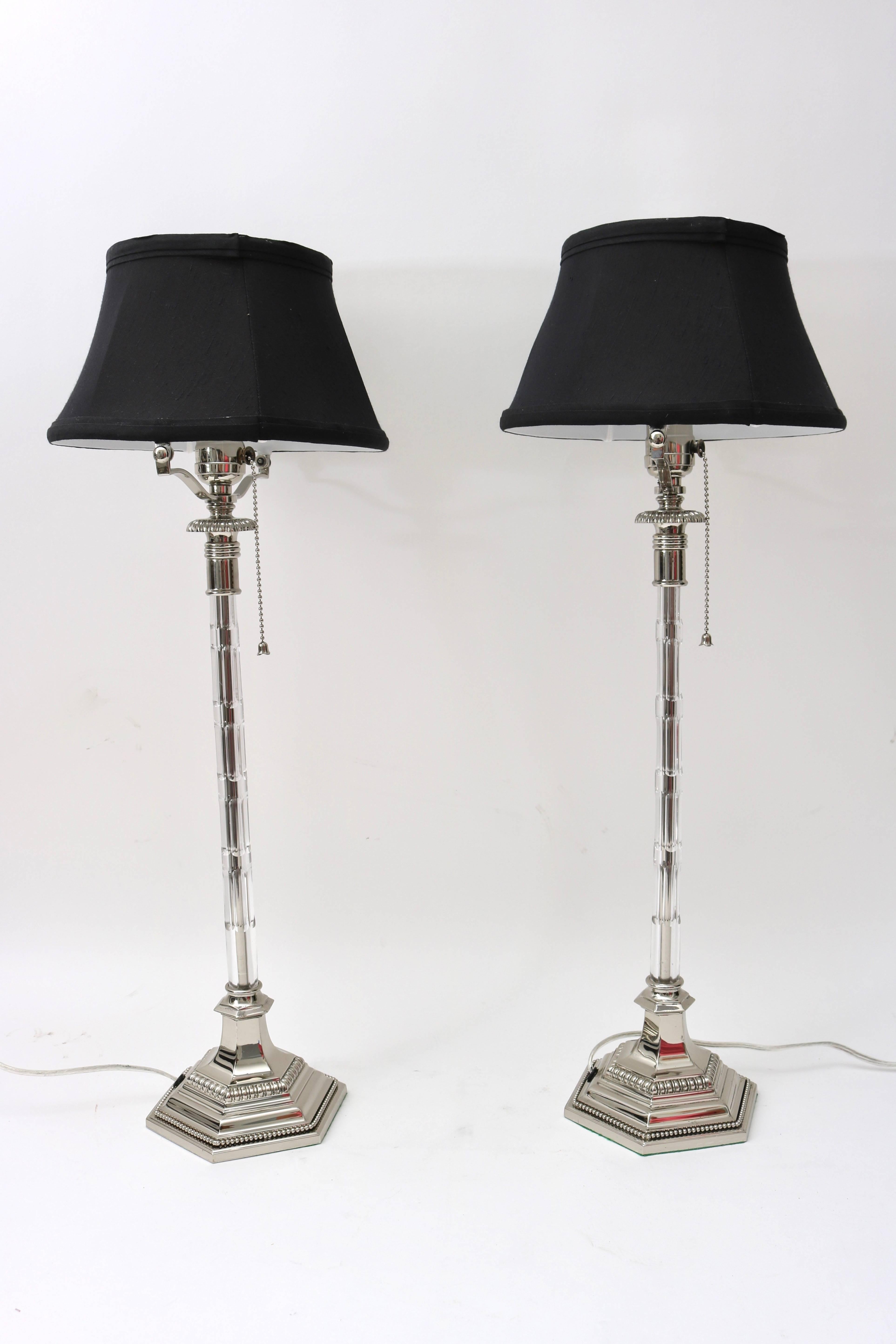 This stylish pair of Art Deco vanity lamps have recently been restored with nickel plating, new wiring and a custom-made shade. The rare form and design are the height of glamour of the 1920s.

For best net trade price or additional questions