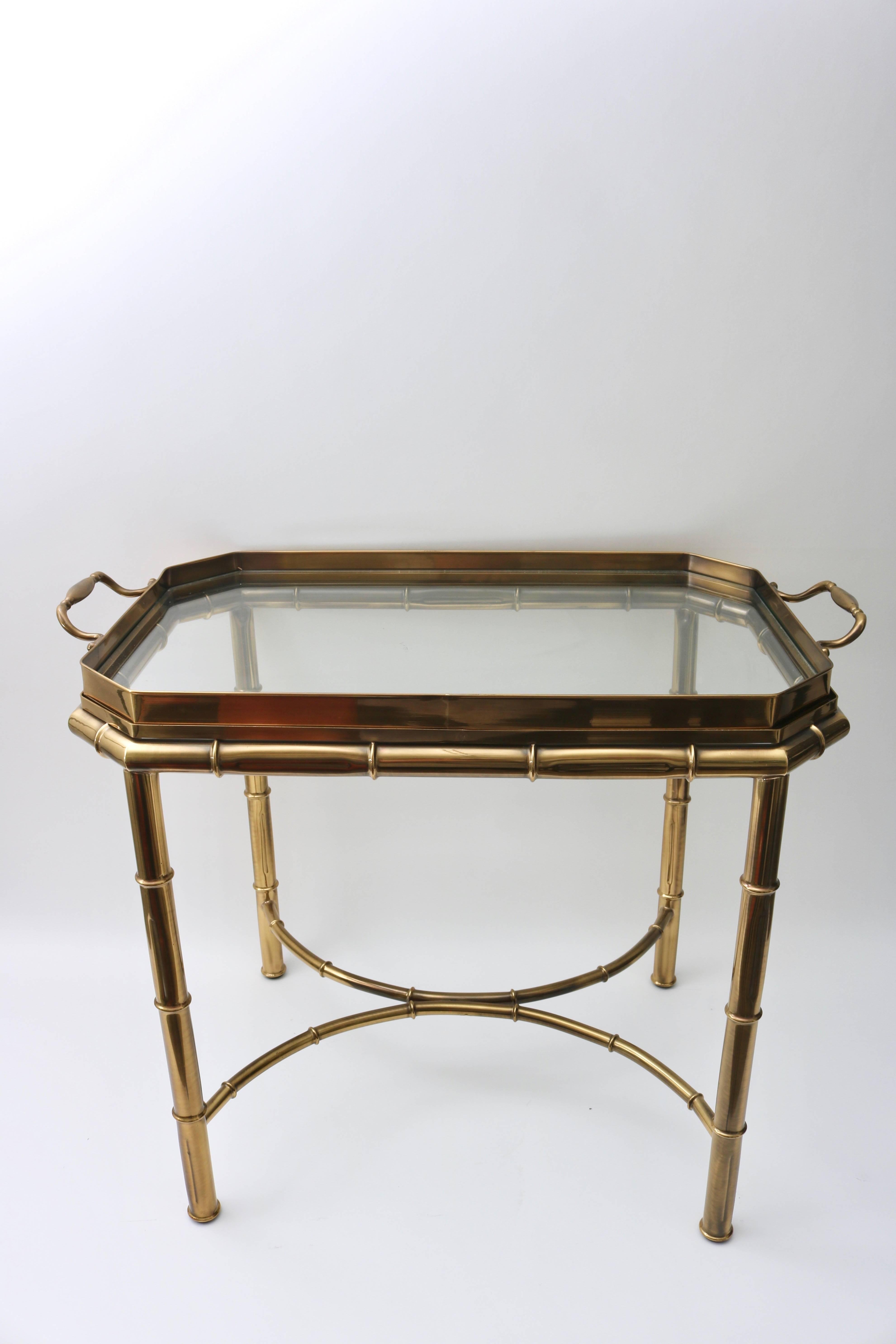 This stylish Master Craft furniture, Hollywood Regency faux bamboo table has a removable tray top that make serving an ease. The antique brass finish is subtle and Classic and has been maintained beautifully.


