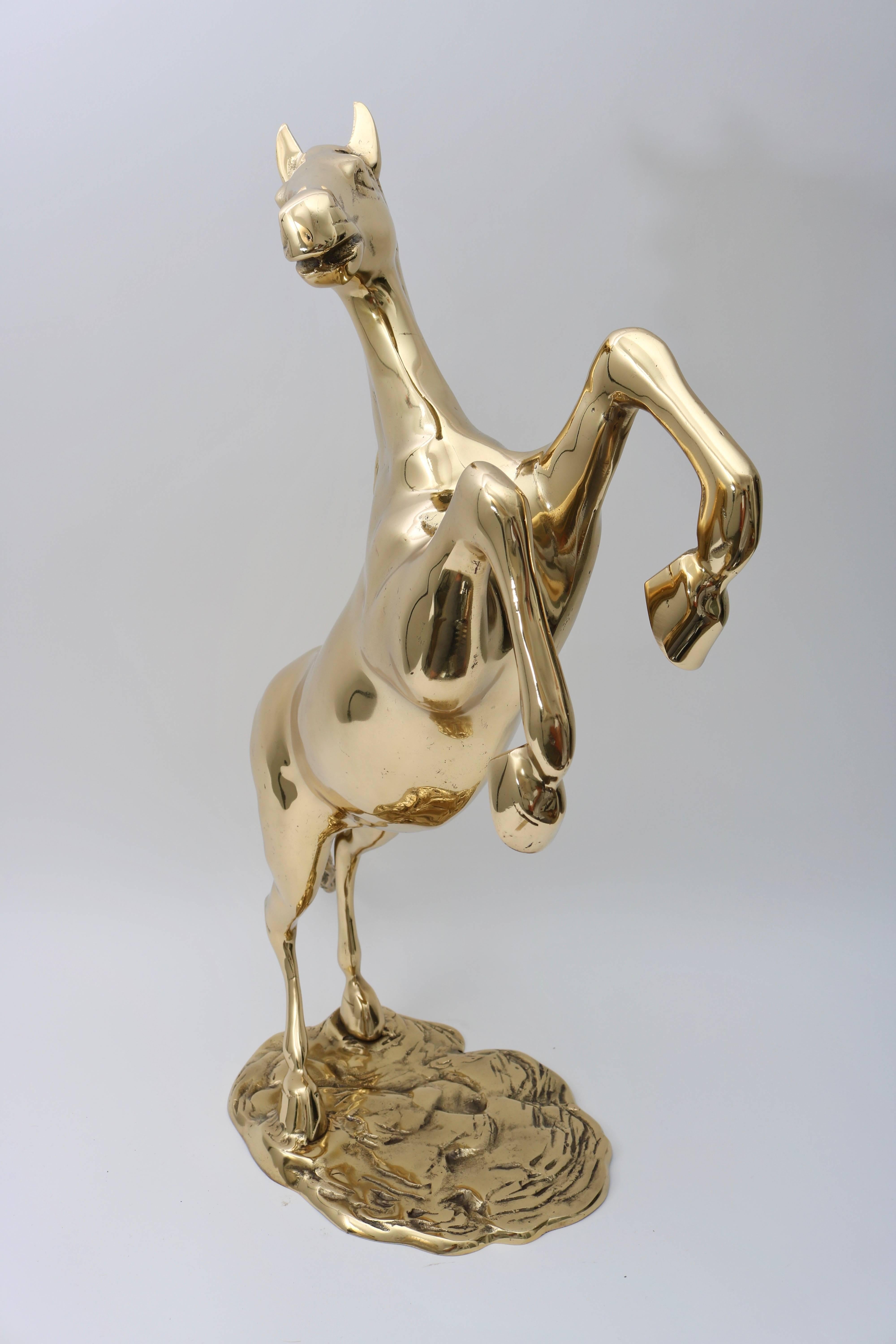 This large-scale sculpture of a rearing horse dates to the 1950s and has recently been professionally polished and has a clear lacquer coating.

Note: Base dimensions are 8.75