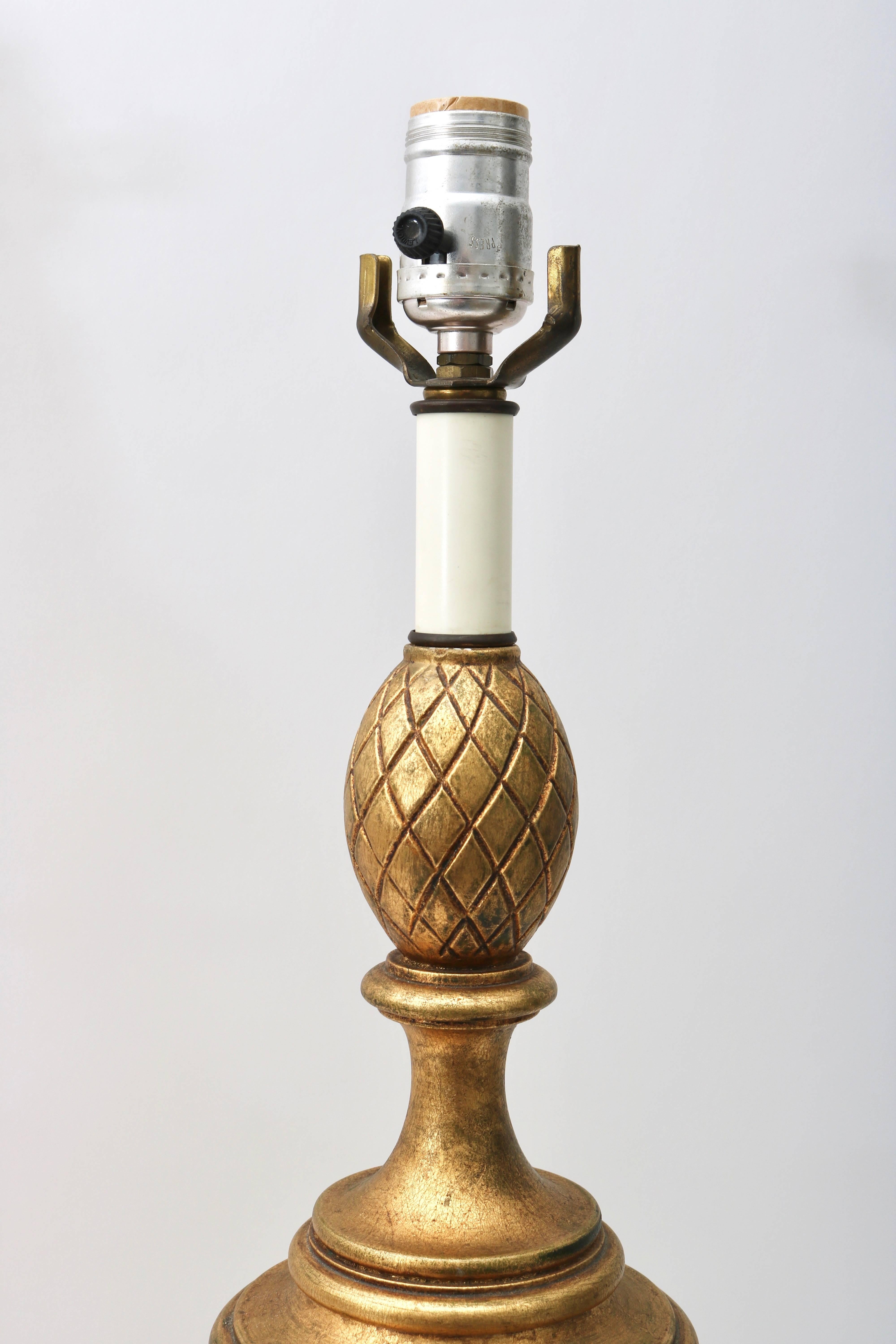 20th Century Pair of Louis XVI Style Urn-Form Table Lamps in a Bright, Antique Gold Finish