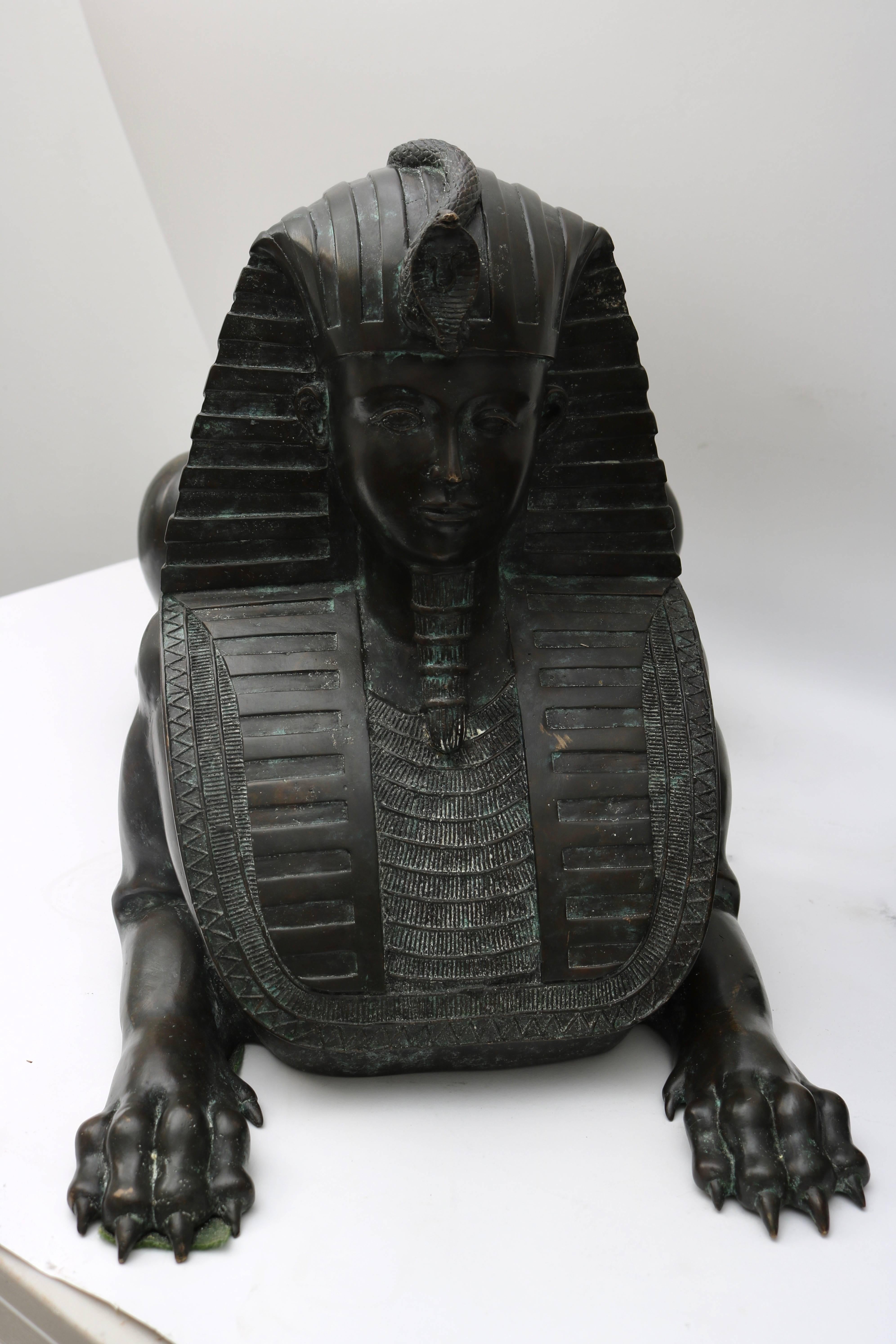 This stylish pair of bronze French Empire style sphinx were recently purchased from a Palm Beach estate and will make the perfect addition to you home or garden. They have a wonderful aged patina and if you will please see image #9 of the cobra that