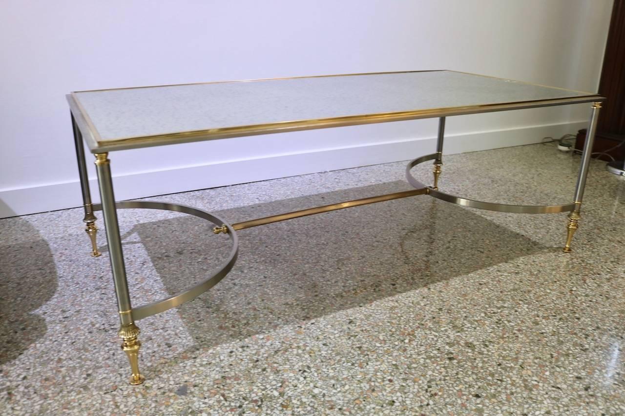 This stylish cocktail table is very much in the style of pieces created by the iconic firm of Maison Jansen in the 1960s and 1970s with its classical lines and quality of materials.

This piece has recently been professionally polished and a new