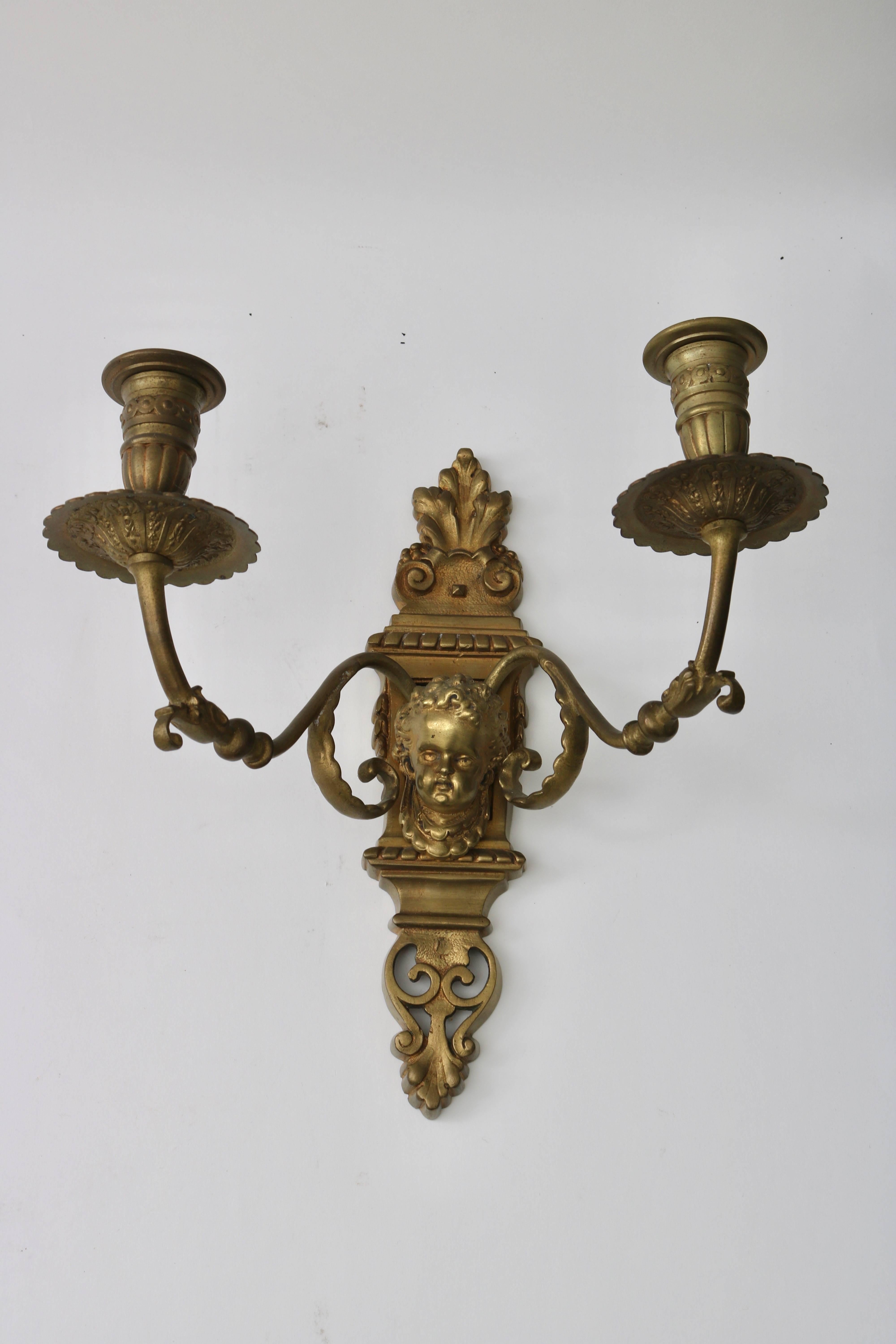 This stylish pair of wall sconces date the late 19th century and are in Louis XVI style with their restrained lines and classical details.

Note: These have not been electrified.

Note: The arms on one of the sconces in not aligned with the