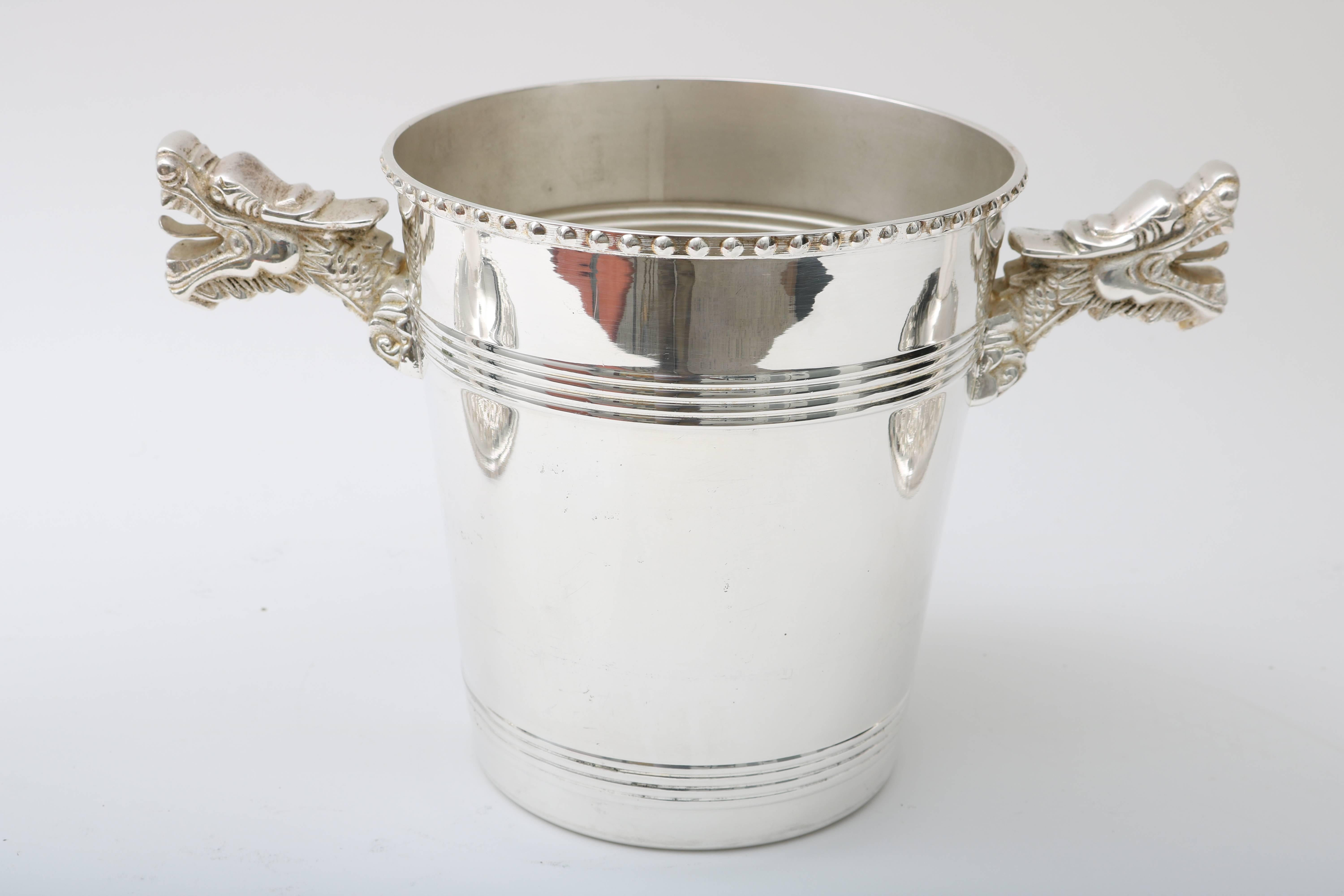 This stylish and extravagant pair of champagne buckets were recently acquired in London and are very much in the style of pieces coveted by Tony Duquette with their 