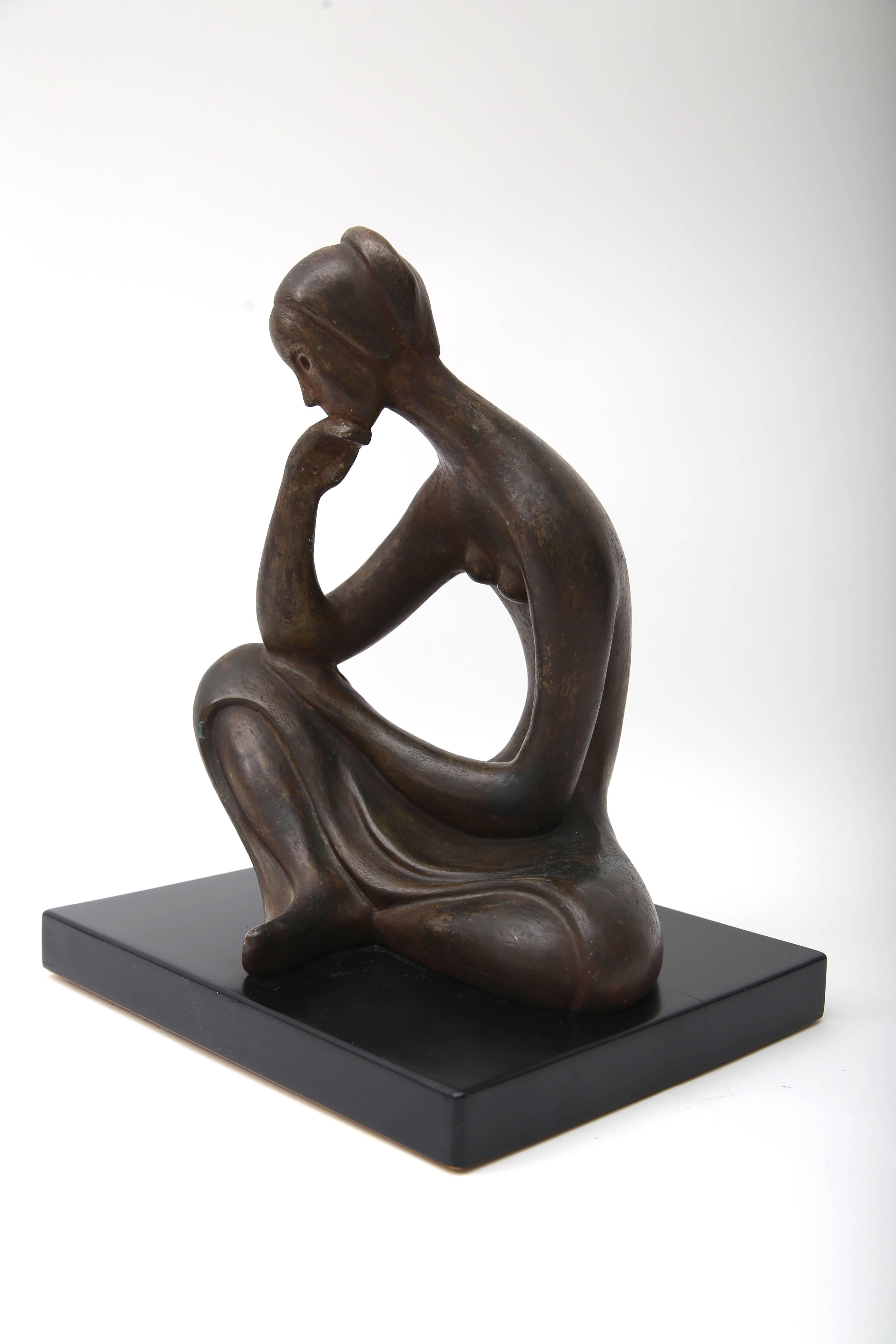 This piece was recently purchased from a Palm Beach estate and is very much in the style of sculpture by Henry Moore. This piece has a handsome bronze coloration and black base.

 