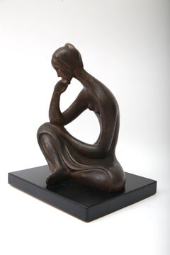 Sculpture of a Seated Female in Bronze Coloration