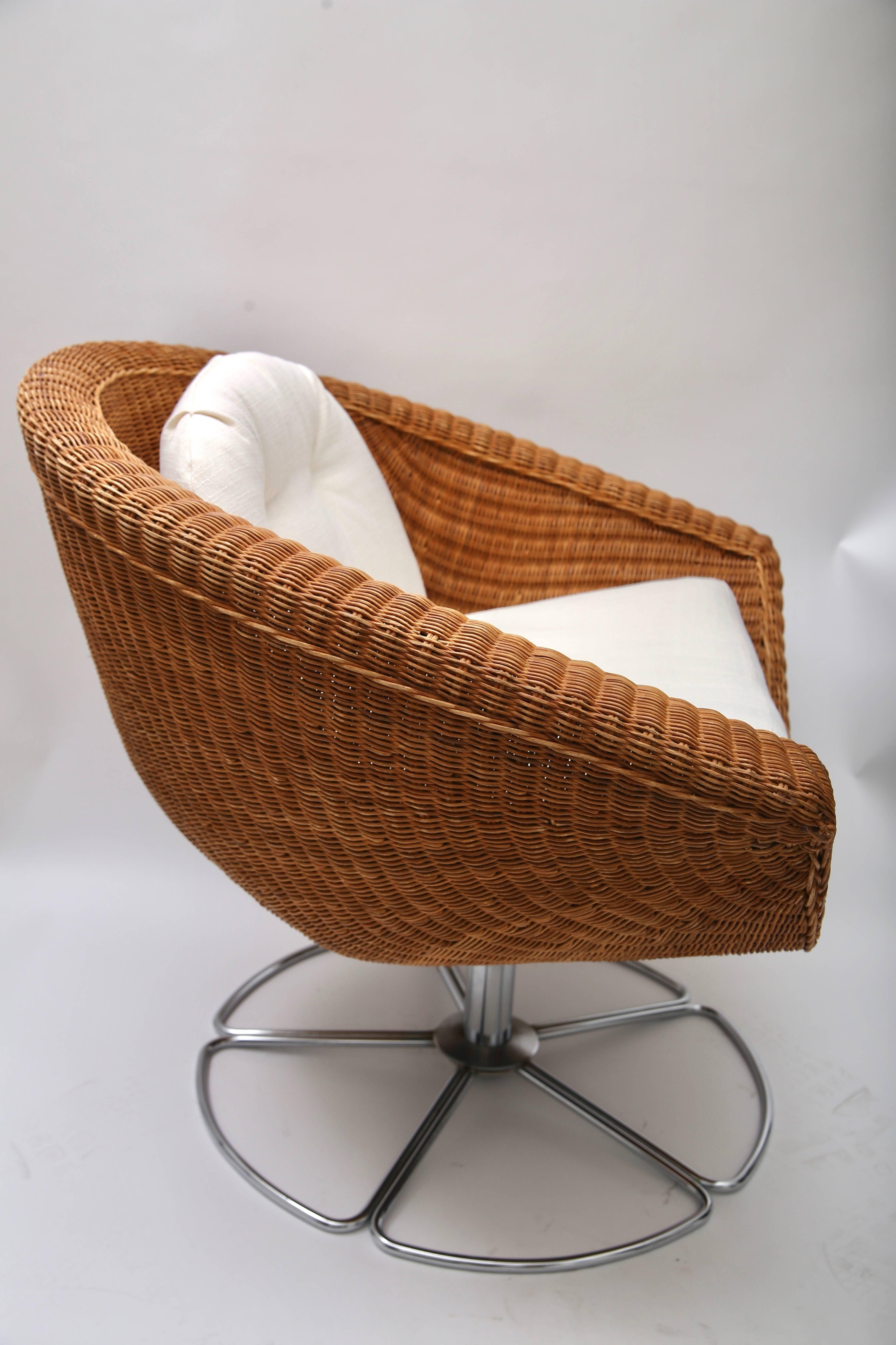 This stylish pair of wicker chairs will make the perfect addition to your summer bungalow, downtown loft or perhaps your pied-a-terre to add some Italian inspired Bohemian texture and mood.

The pieces swivel and the upholstery is newly done in an