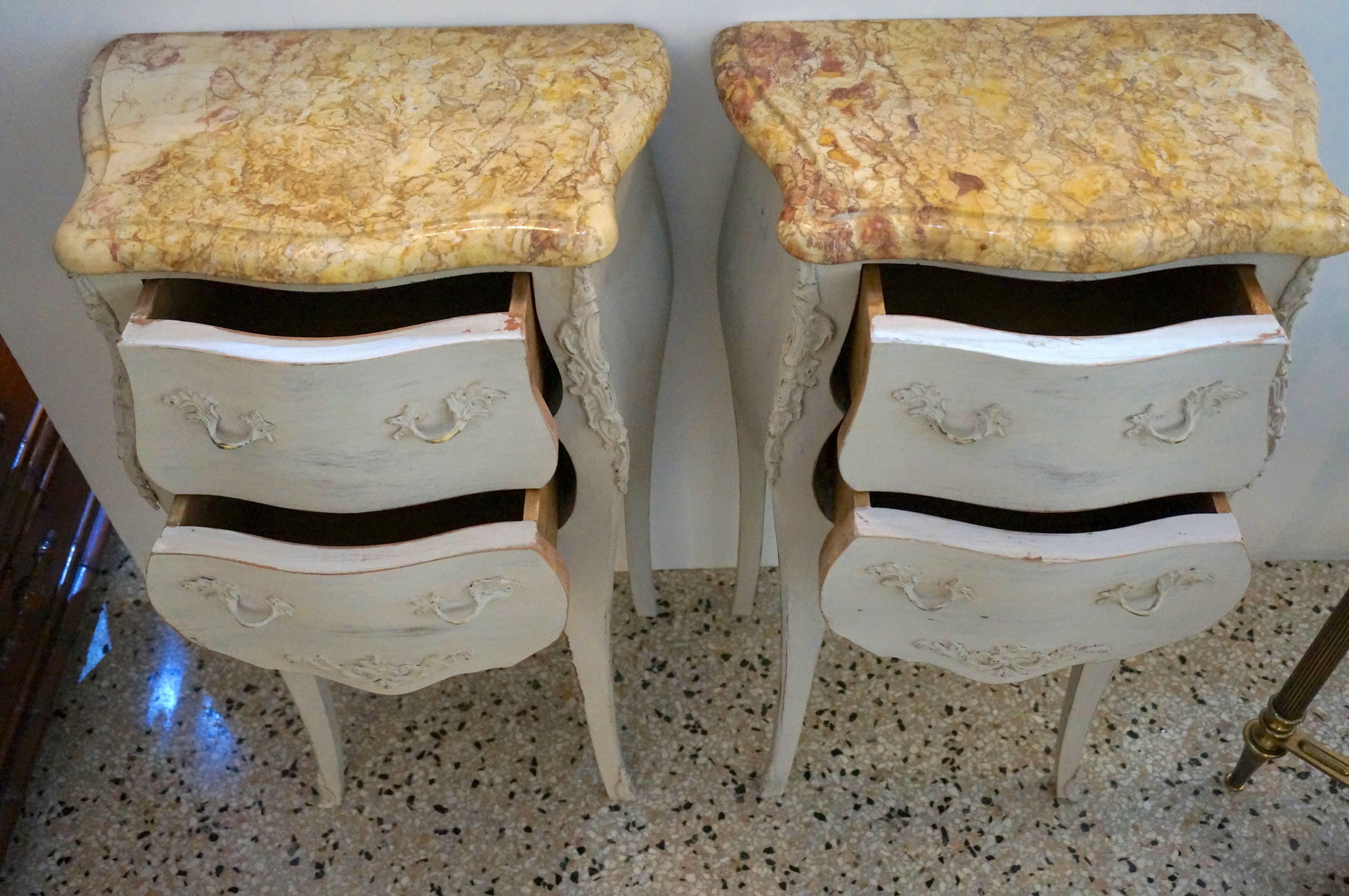 This stylish set of nightstands date from the 1920s and are painted a soft grey which works beautifully with the golden and aubergine veined marble tops. The piece were recently purchased in London but originate from France.