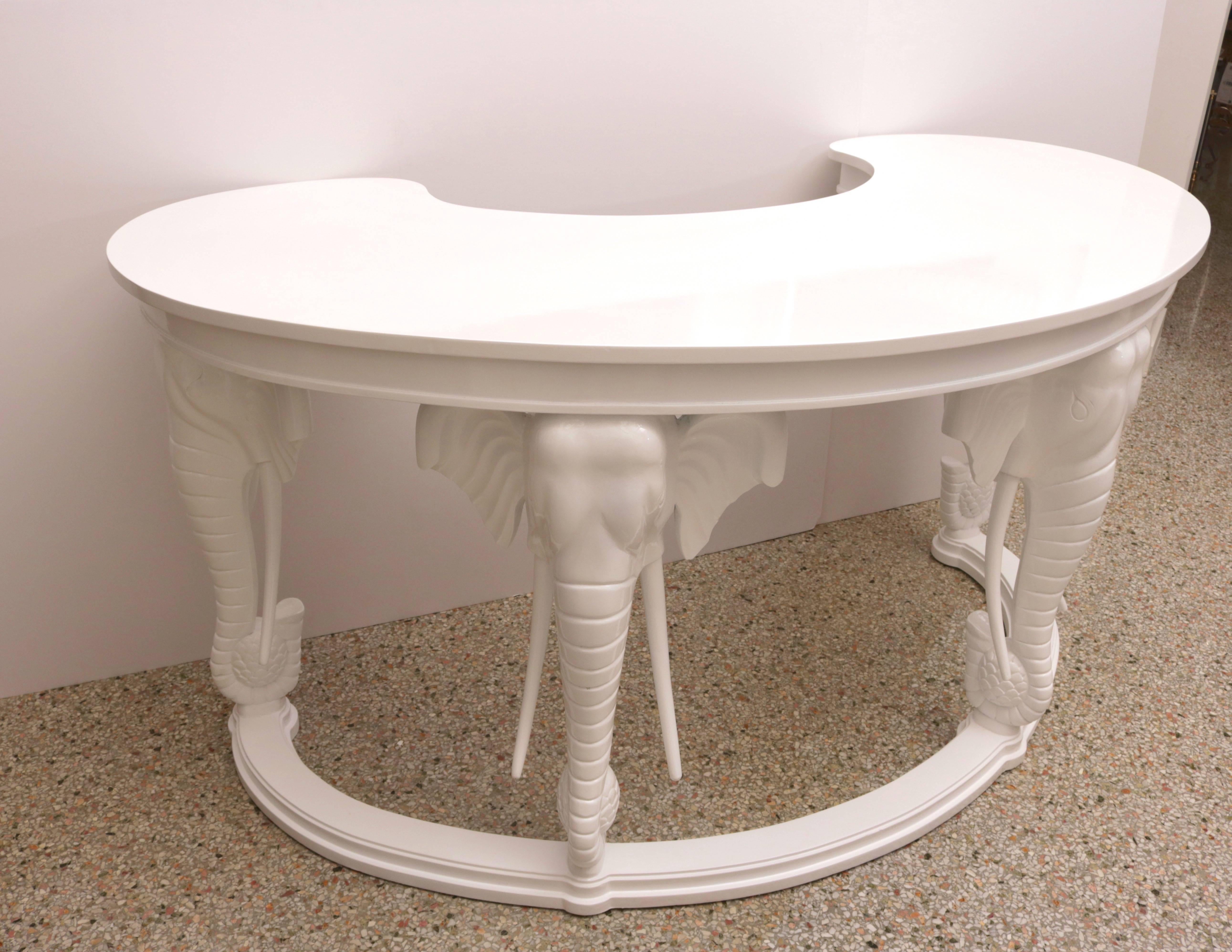Hollywood-Regency style kidney-shaped, elephant motif desk in white by Gampel Stoll and has been professionally lacquered in white and will make the perfect statement piece in you home.

Please feel free to contact us directly for a shipping quote