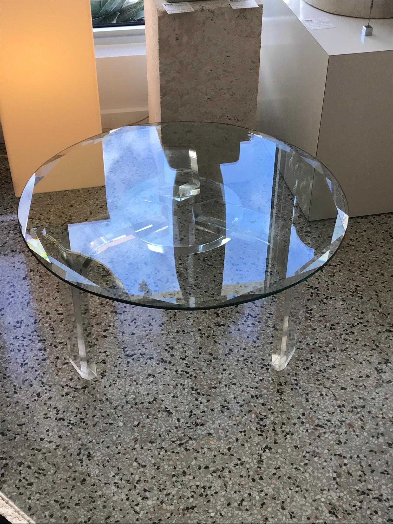 This glamorous (signed) Les Prismatiques round cocktail table was created in the 1970s. It is of the highest quality Lucite and 3/4