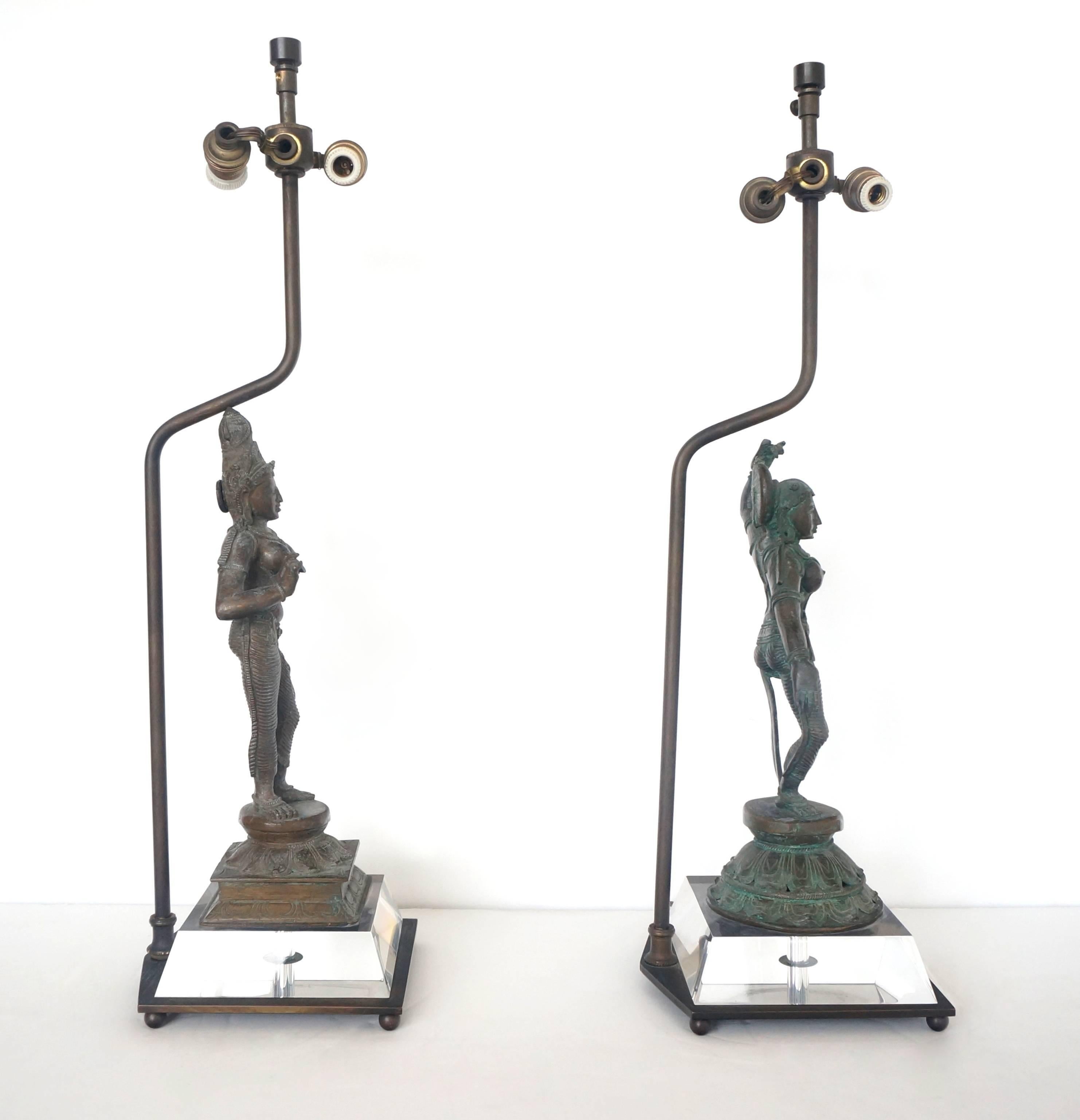 This set of two table lamps were created using two bronze castings of the Hindu goddess Uma (or Parvati). The pieces date from the 19th century and possibly earlier. The electrical hardware looks to date from the 1930s-1940s and both are in working
