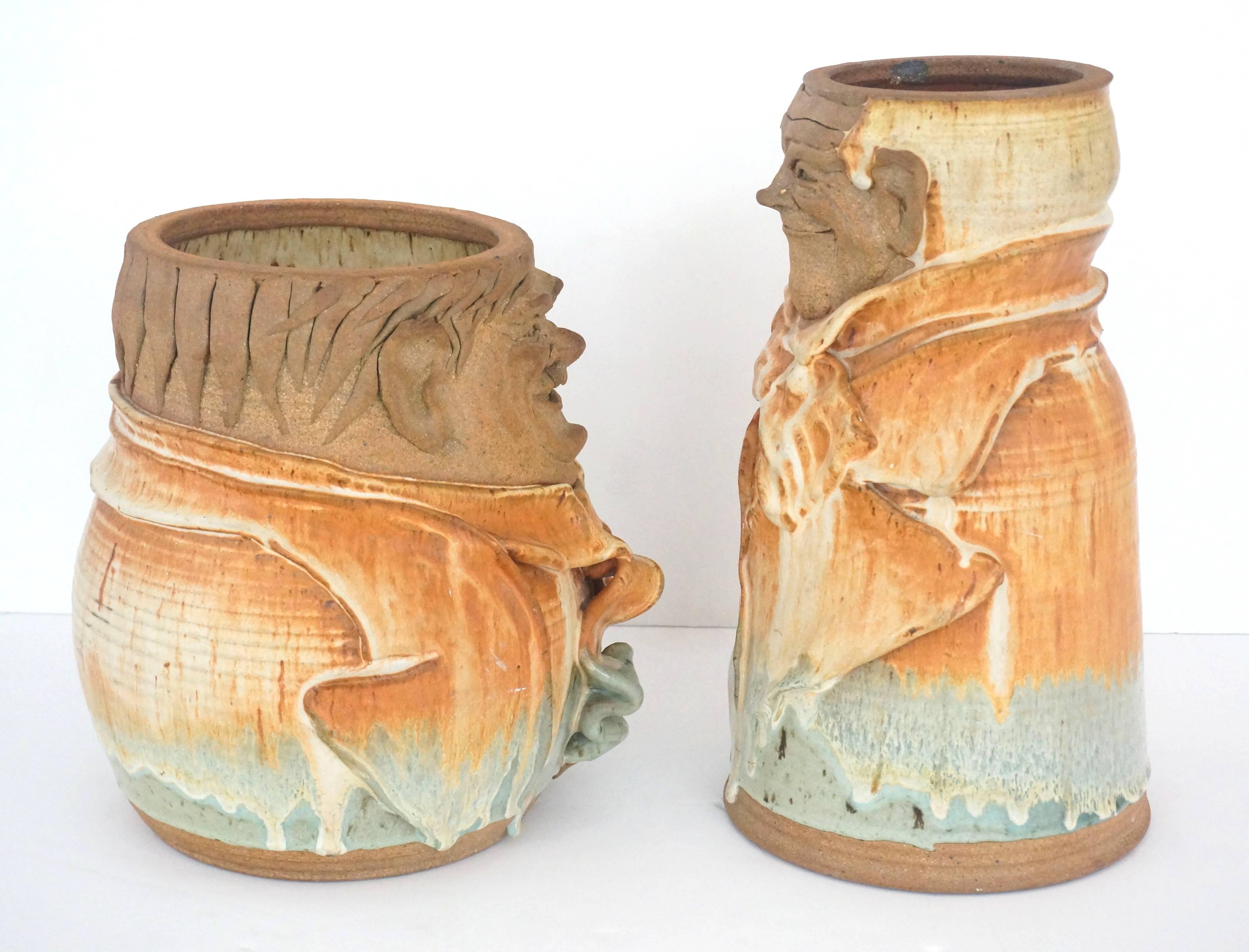 This set of artisan created earthen ware pottery vases are in the stylized forms of the American film actors Laurel and Hardy.

Note: Each is inscribed on the underside 