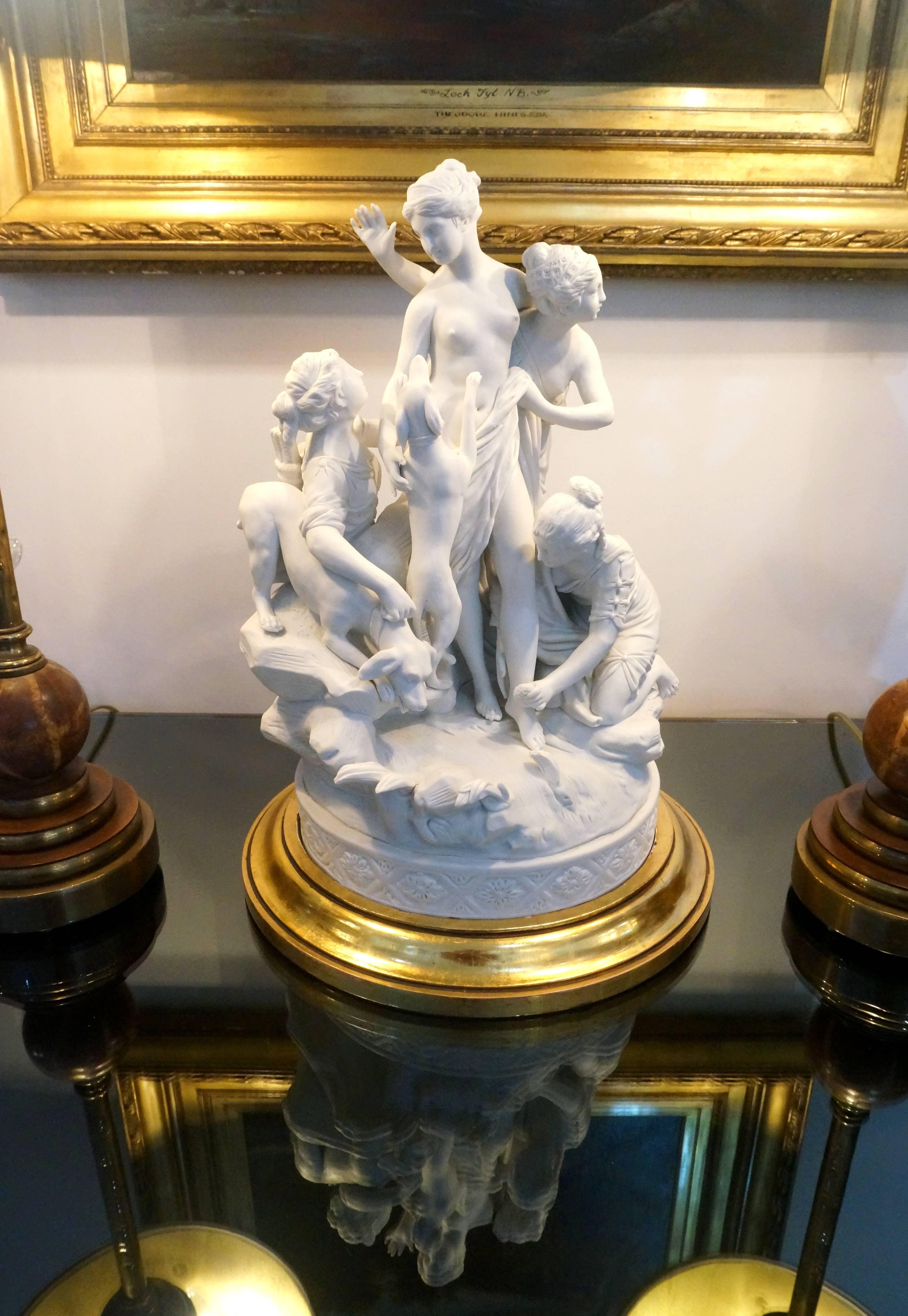 This figural sculpture depicting Diana at the bath is a sevres, biscuit porcelain and dates from the late 20th century. The piece is mounted on a 18-karat parcel-gilt finished base.

FYI.
Louis-Simon Boizot (1743–1809) was a French sculptor whose