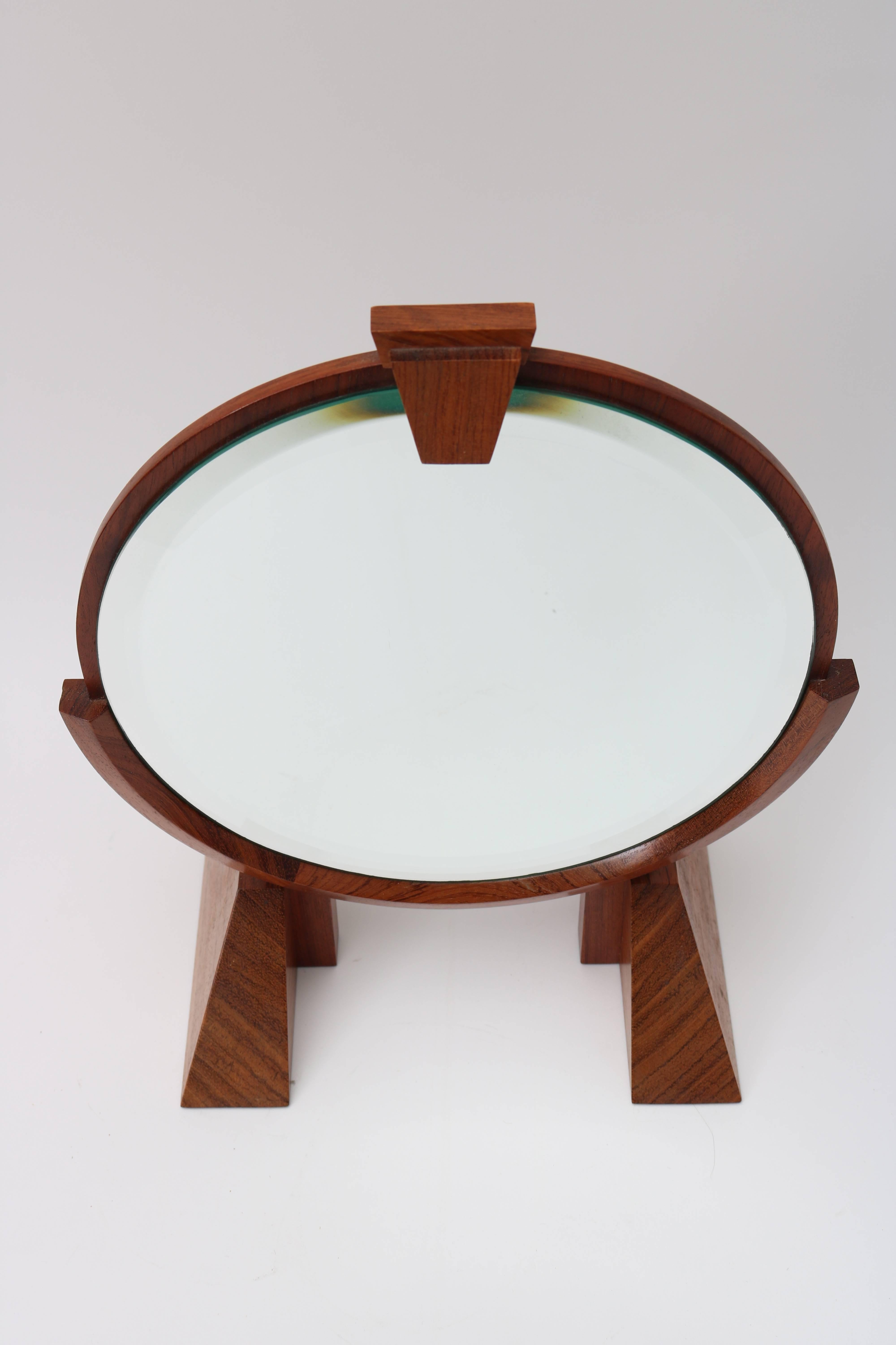 This artisan piece will make the perfect addition to your Mid-Century dressing table with its adjustable angle mirror, clean lines, simple form and beautiful use of woods.

Note: Diameter of mirror is 9.50