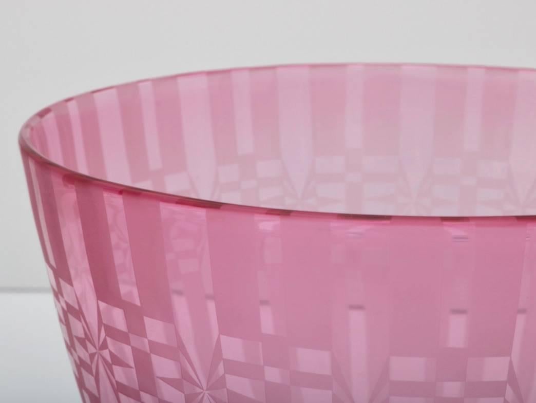 This beautiful piece of American Art Glass was created by the Benetti Studios some time in the 1980s. The translucent violet coloration of the vase form has been acid etched with a geometric pattern and is signed Benetti Studios.

