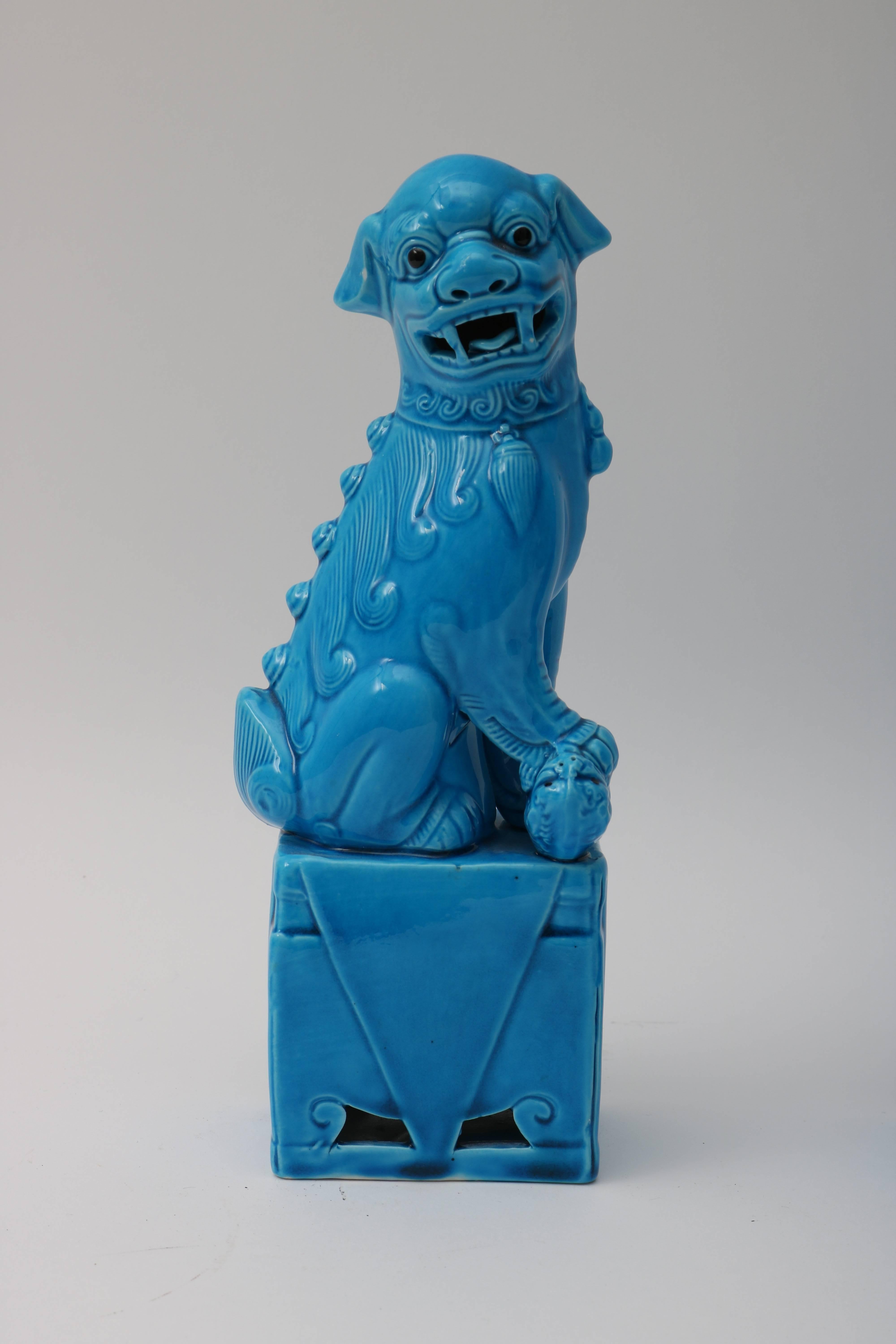 This stylish pair of 1920s Chinese, glazed, peking-blue, male foo dogs will make the perfect accessory to your Hollywood Regency interior or perhaps as a spot of color and Classic style to your modern home.

Note: Images 9 & 10 have incised makers