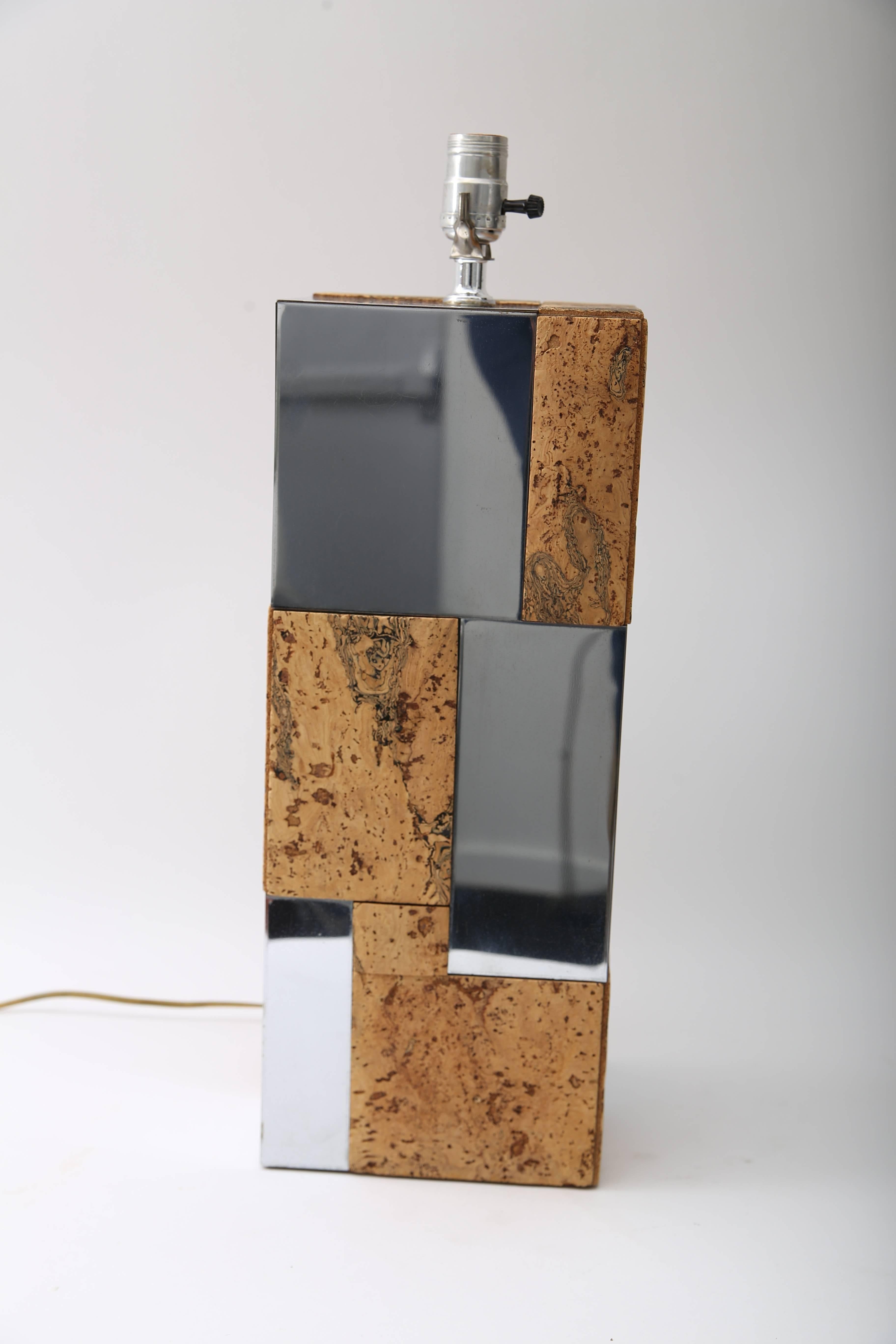 This stylish table lamp dates to the 1970s and is fabricated in cork and polished chrome in a 