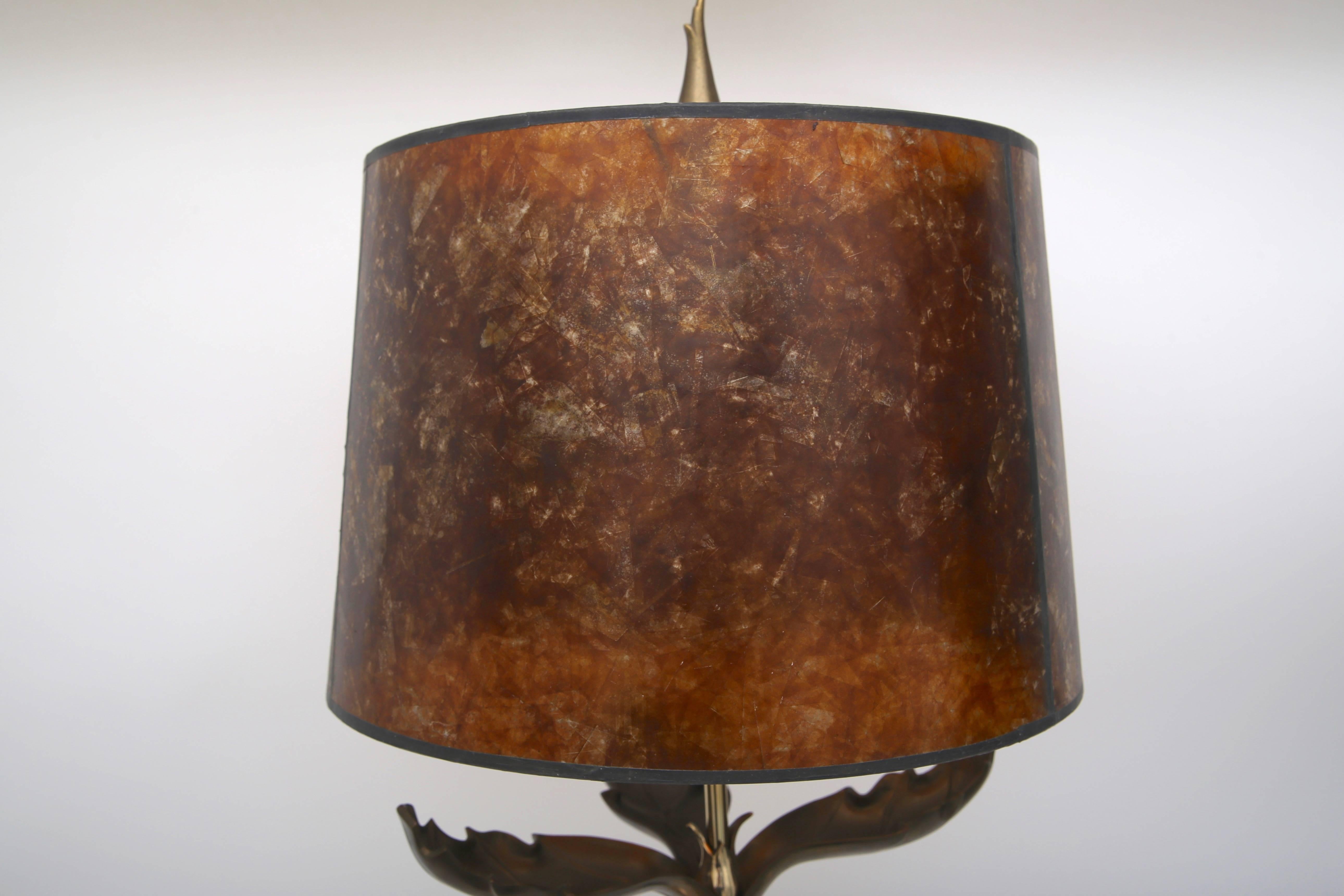 This piece is very much in the style of lamps by Chapman Manufacturing company and dates to the late 1970s or early 1980s.

Note: This piece has been professionally restored with new wiring, polished and lacquered metal and a new mica