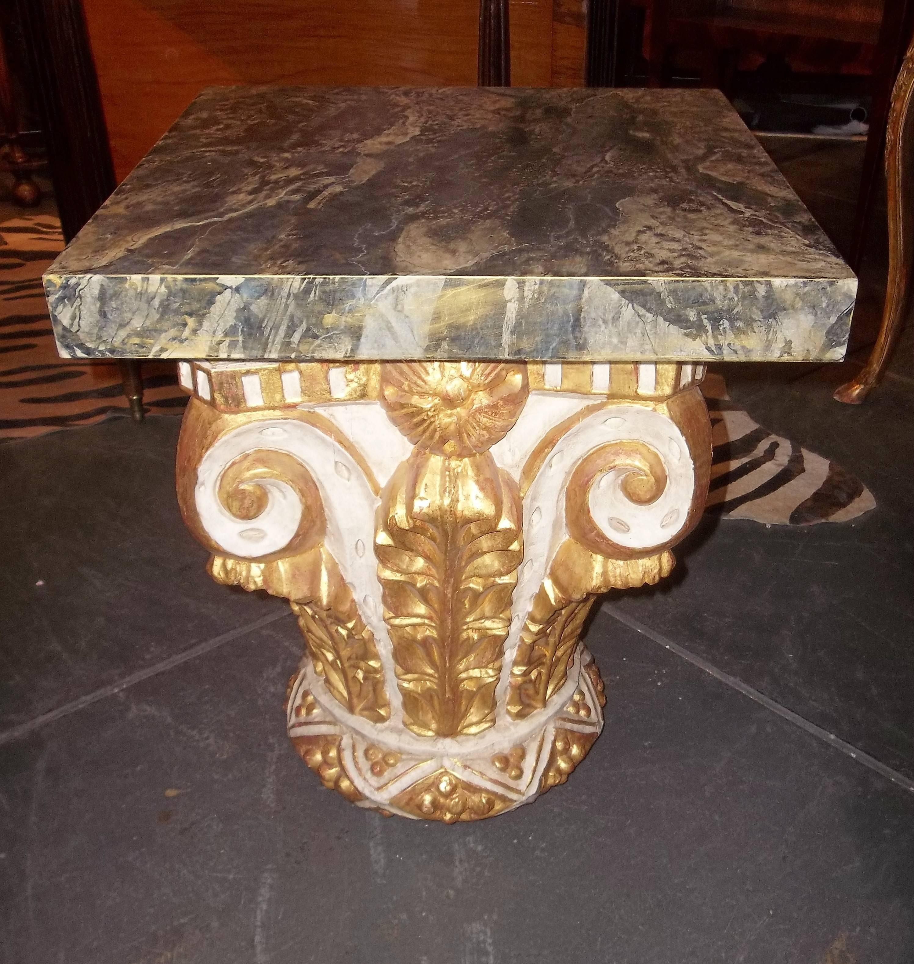 With a later imitation marble top. The architectural capital of carved wood, probably early 19th century with later gilt or refreshed decoration. Showing usual signs of time, wear and use.

As being solid wood (heavy) this will not go UPS and will