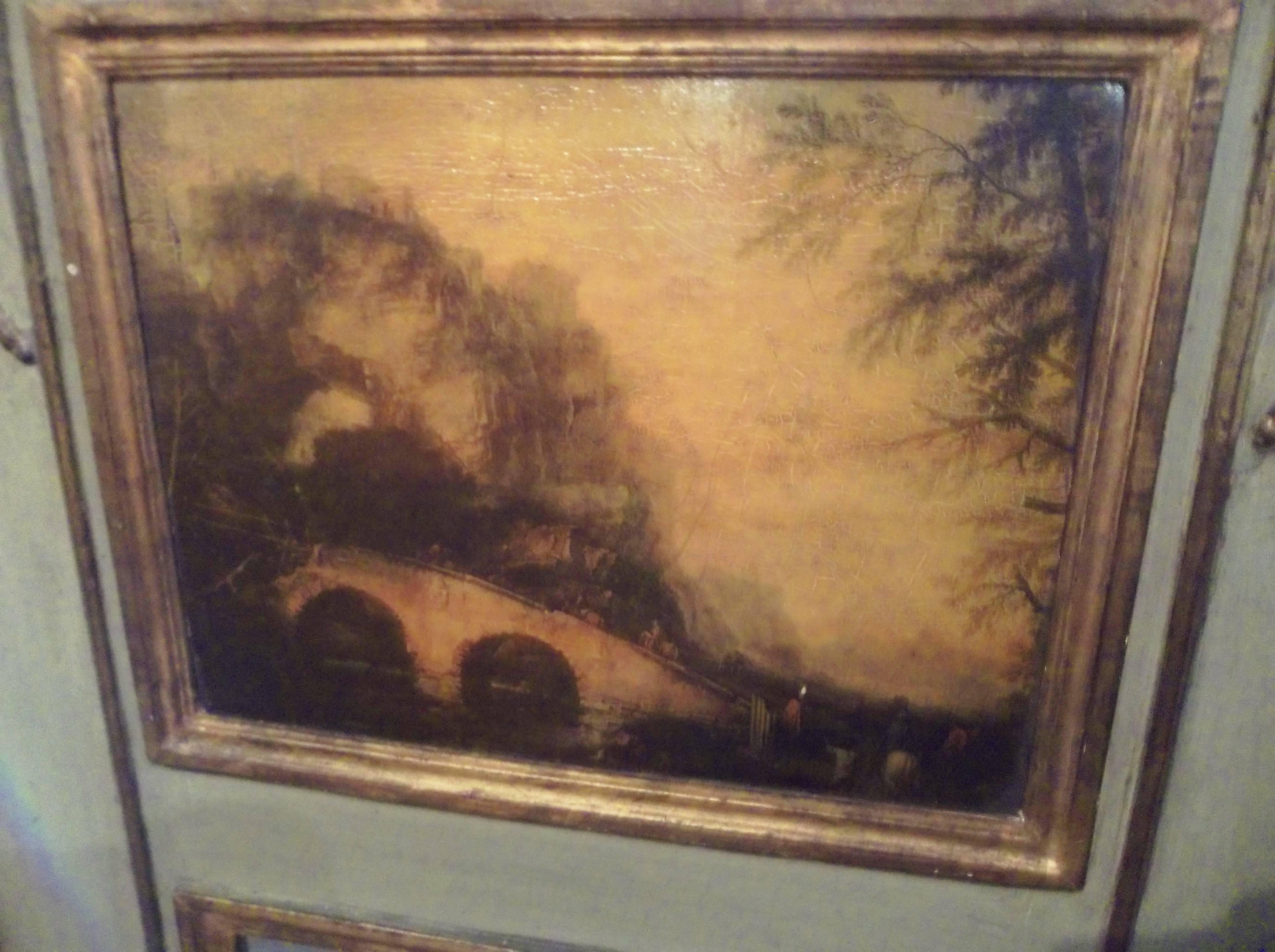The trumeaux with scenes of a landscape with bridge and a harbor scene (possibly Venice). Gilt decoration against a nicely worn and dusty green ground. Peg construction. Bleeding of red bole through the gilding. 

Typical oxidation and wear to