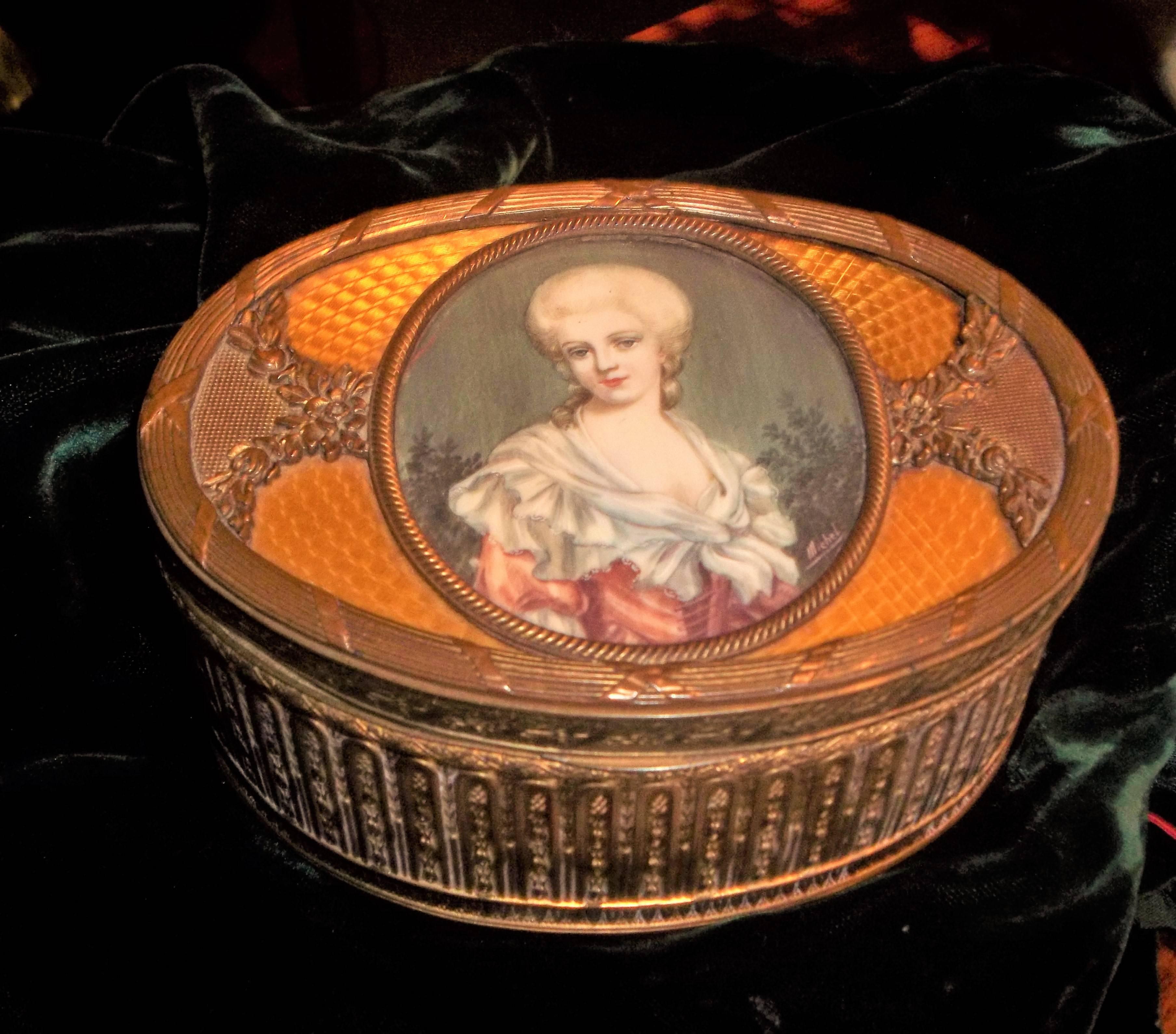 Striking gold engine turned enamel surrounding a depiction of a lady. The sides and top lid with crisp detailed casting. Padded interior.

with court portrait inset and signed  'Michel