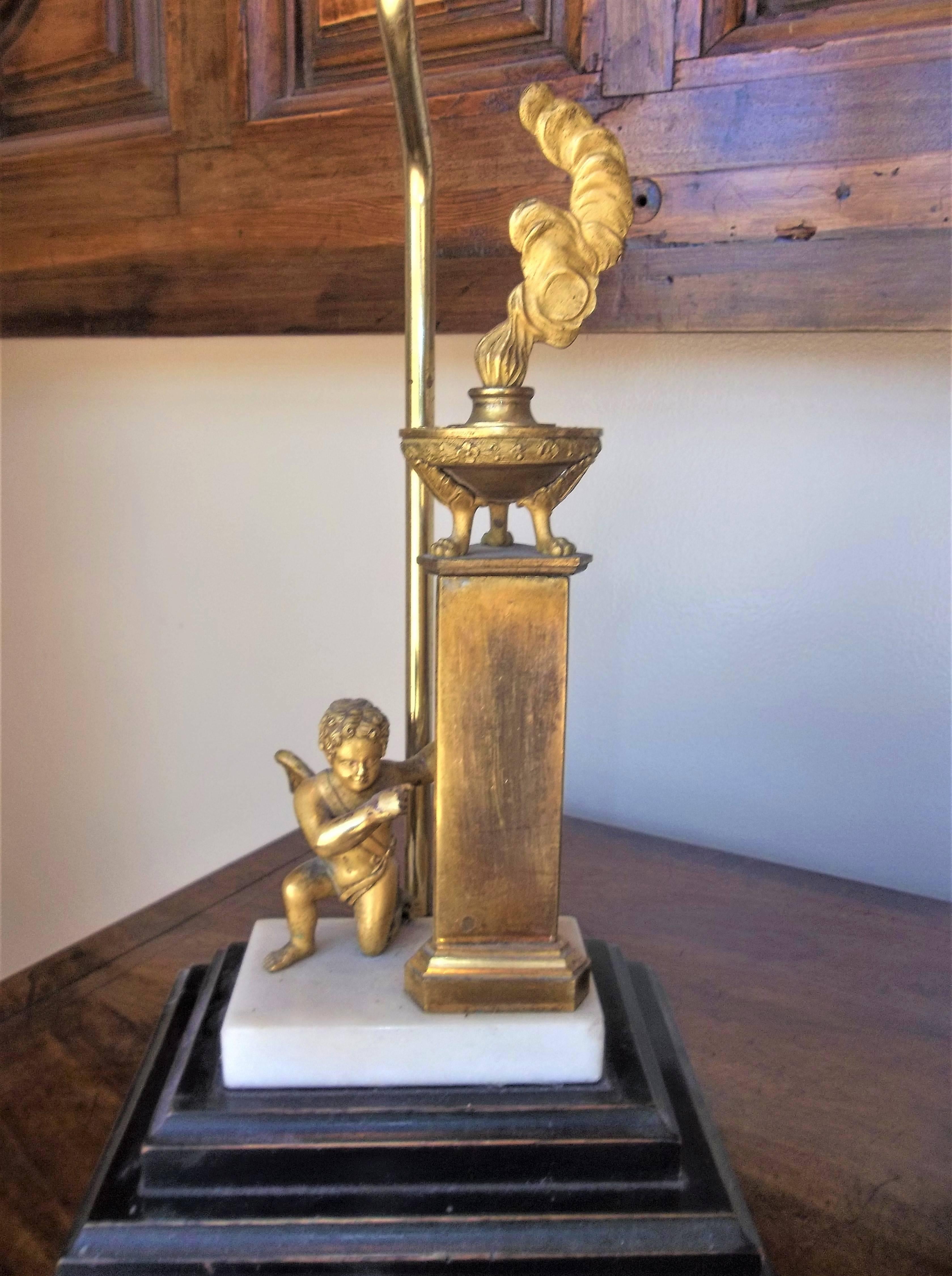 Now mounted as lamp with a red silk pleated shade later base and lamp fittings. The Grand Tour probably Directoire or early Empire period. It is glued down to later base and can be detached for use as a Grand Tour only . The ormolu figure with