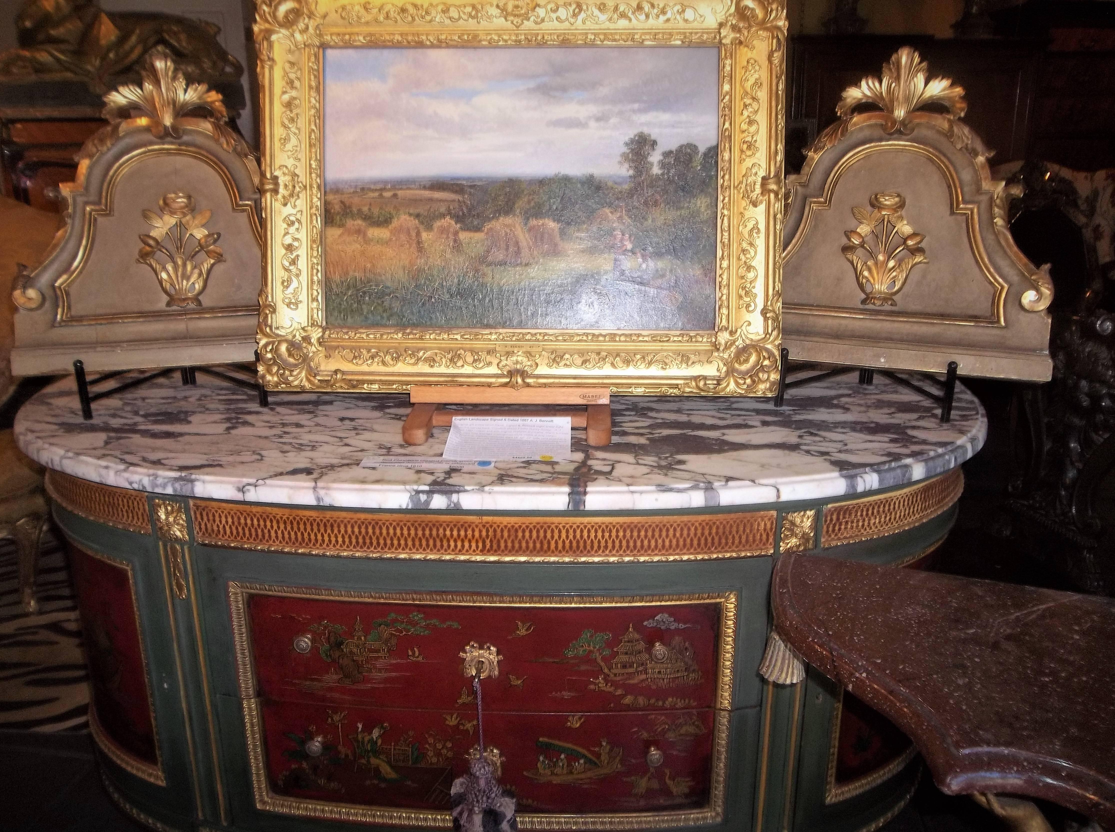 In Louis XV to Louis XVI transitional style. Carved wood in a grey beige ground
with giltwood lotus blossom in carved relief . 

Light bleeding of the red-orange bole through the gilt. Typical wear and use.
Losses to gilt with expected touch-ups.