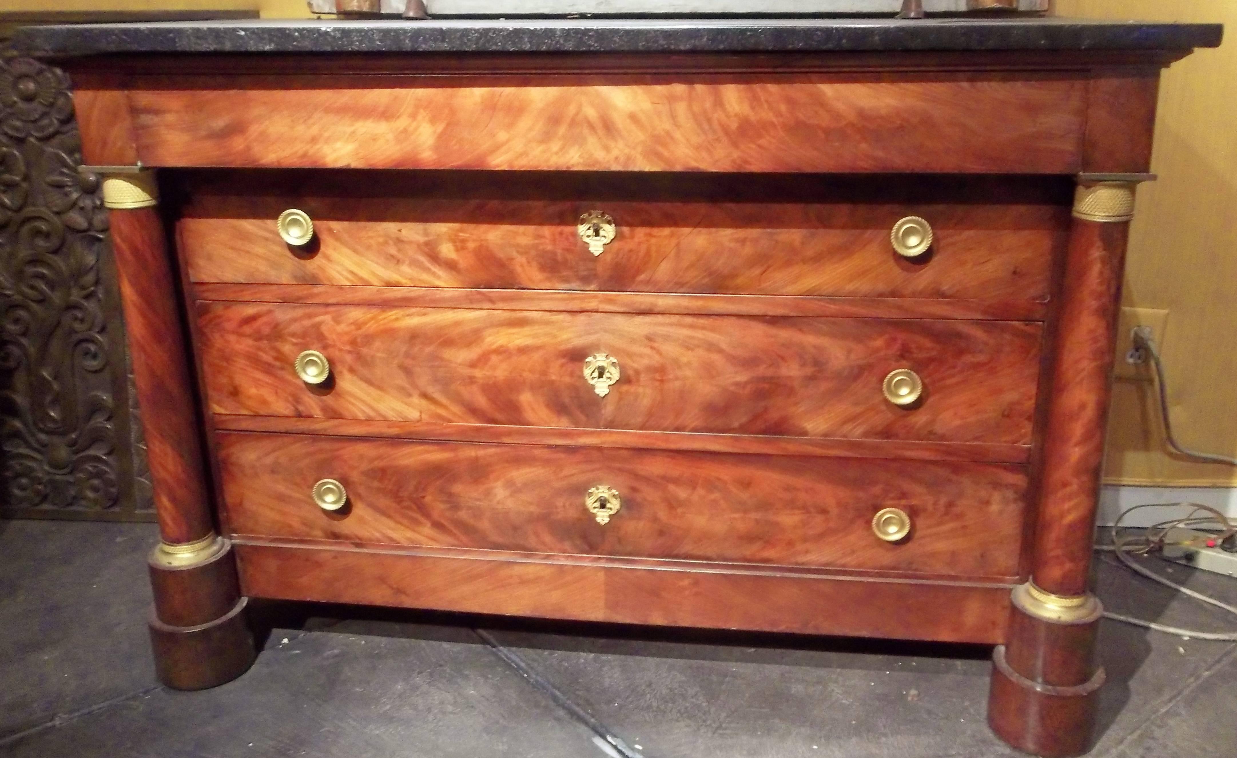 A charmingly faded mahogany chest producing a warm mellow patina. The highly figured wood producing swirls of brown, gold, red accented by very finely cast and chiseled ormolu mounts.

Probably Second Empire or mid-19th century.