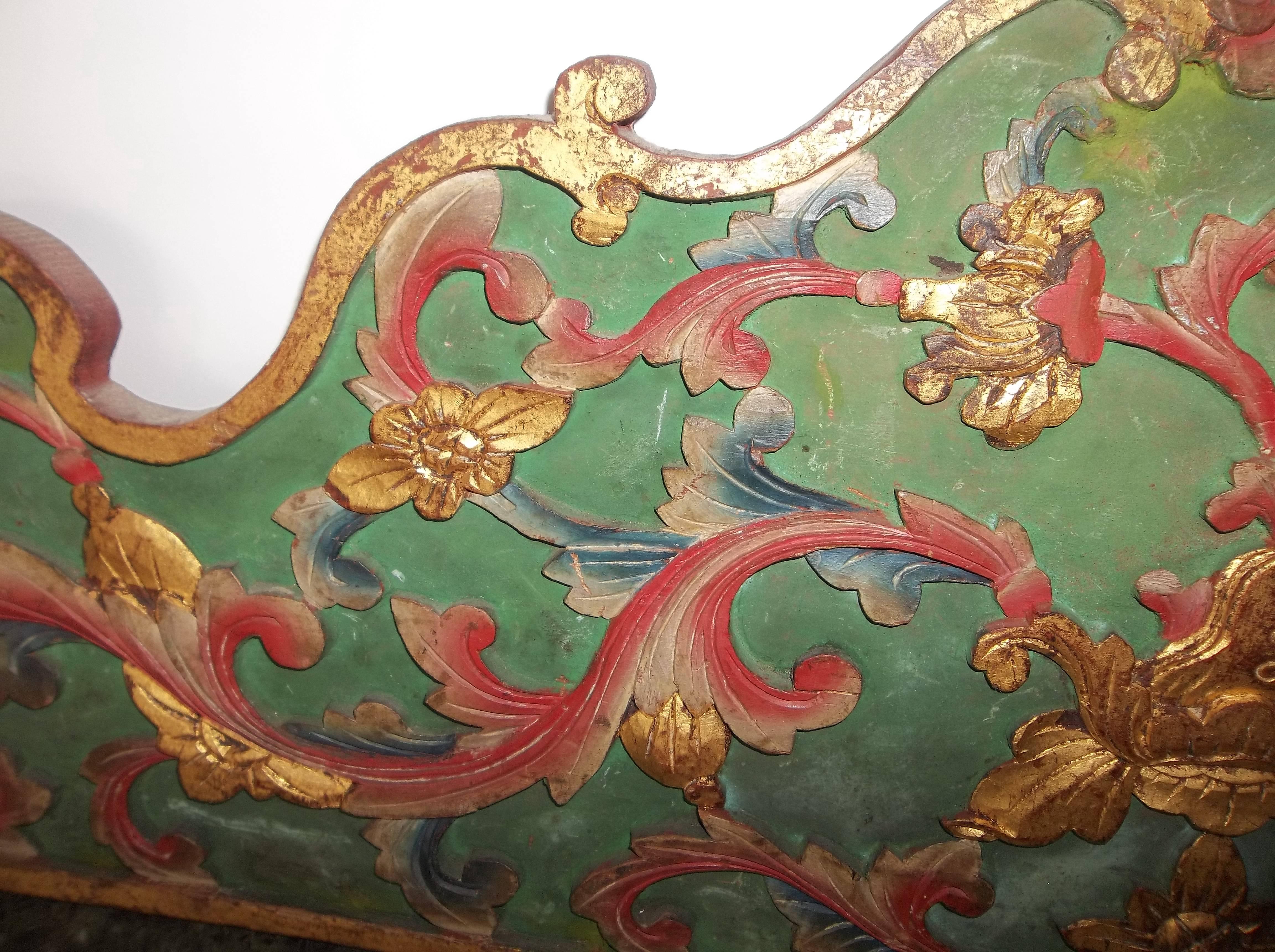 20th century, green ground with pink, blue and gilt highlights on floral and foliate lattice carving. Rococo or scalloped top.

Probably early to mid-20th century

Possibly Italian but no markings.

Good condition but usual time and use wear