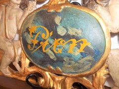 Giltwood and Painted Overdoor Panel Fragment with Cherub Motif