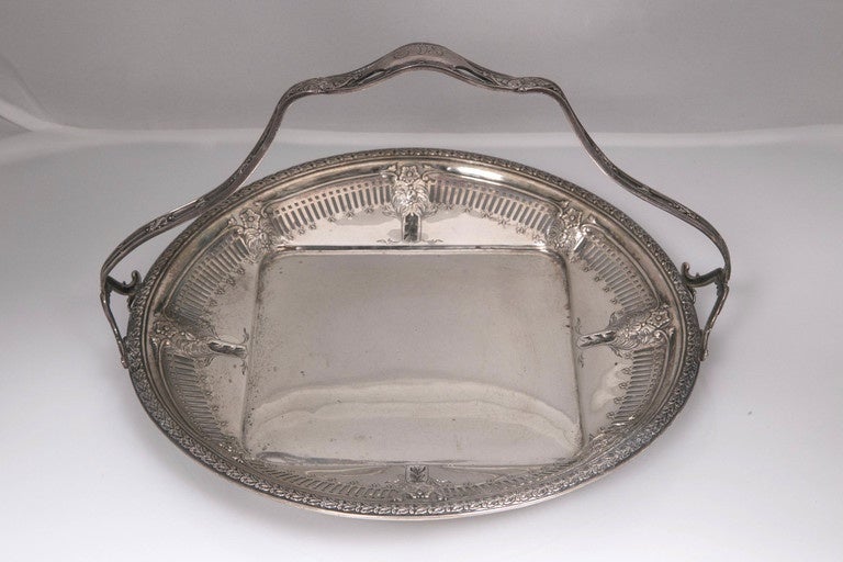 This is just part of a huge private collection of over 350 Antique Smalls, from the 18th & 19th Century.
Antique Sterling Silver Cake Basket American Made 
Has some intricate scroll work along the basket trim.
