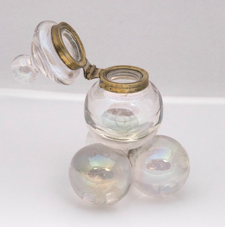 This is just one of our Antique Smalls that we acquired from a private collector.
We have over 350 smalls from the 18th & 19th century.
Antique Bubble Glass Inkwell with gold tone Collar 1899 English.
This is very unusual. Has an irredescent