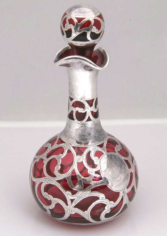 This is just one of the fabulous pieces we have acquired from a private collection.  In the collection is over 350 pieces from the 18th & 19th Century.
Antique Sterling Silver Overlay English Perfume Bottle from 1900, Rare because it has a long
