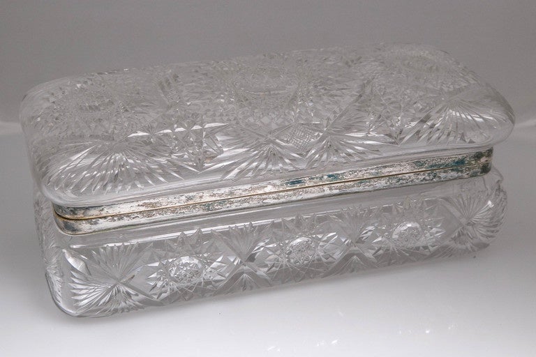 This is just one out of the 350 Antique smalls that we acquired from a private collector.  Most all which all from the 18th/19th century.
Antique 1918 Crystal/Silver Glove Box Amercian, with brillant geometric cuts.
Silver collar.Perfect, cuts are