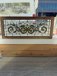 Late 19th Century Stained Glass Transom Window with Jewels and a Beveled Glass.