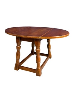 Antique miniature oak drop-leaf table featuring traditional turned baluster legs